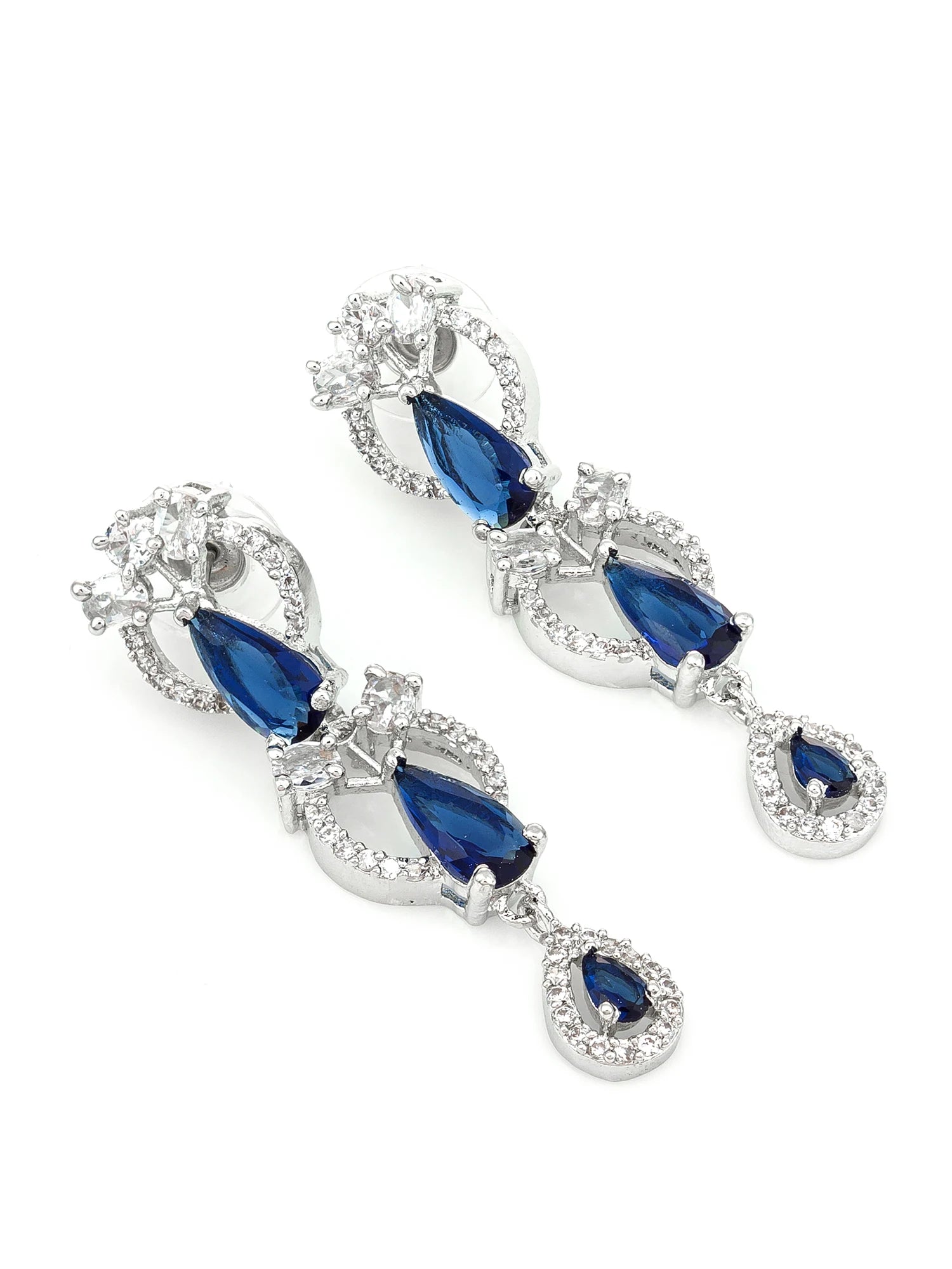 A pair of silver-tone drop earrings featuring deep blue teardrop-shaped gemstones and clear crystal accents, displayed on a clean white background.