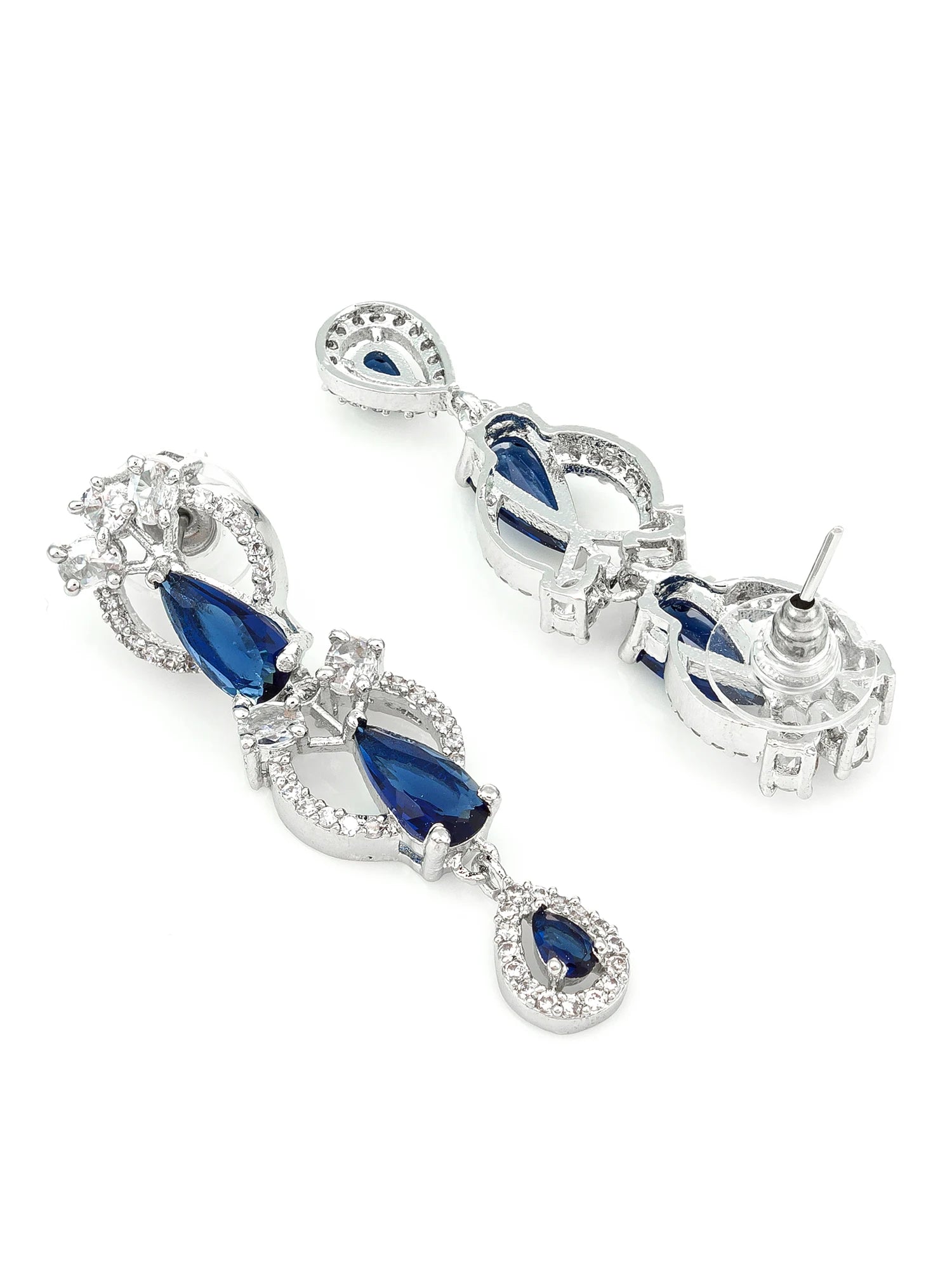 A pair of silver-tone drop earrings featuring pear-cut blue sapphires and clear cubic zirconia accents, displayed on a clean white background.