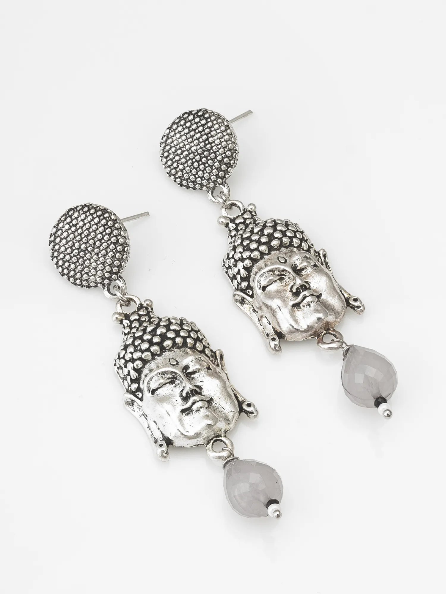 Silver Buddha Face Drop Earrings On A White Background