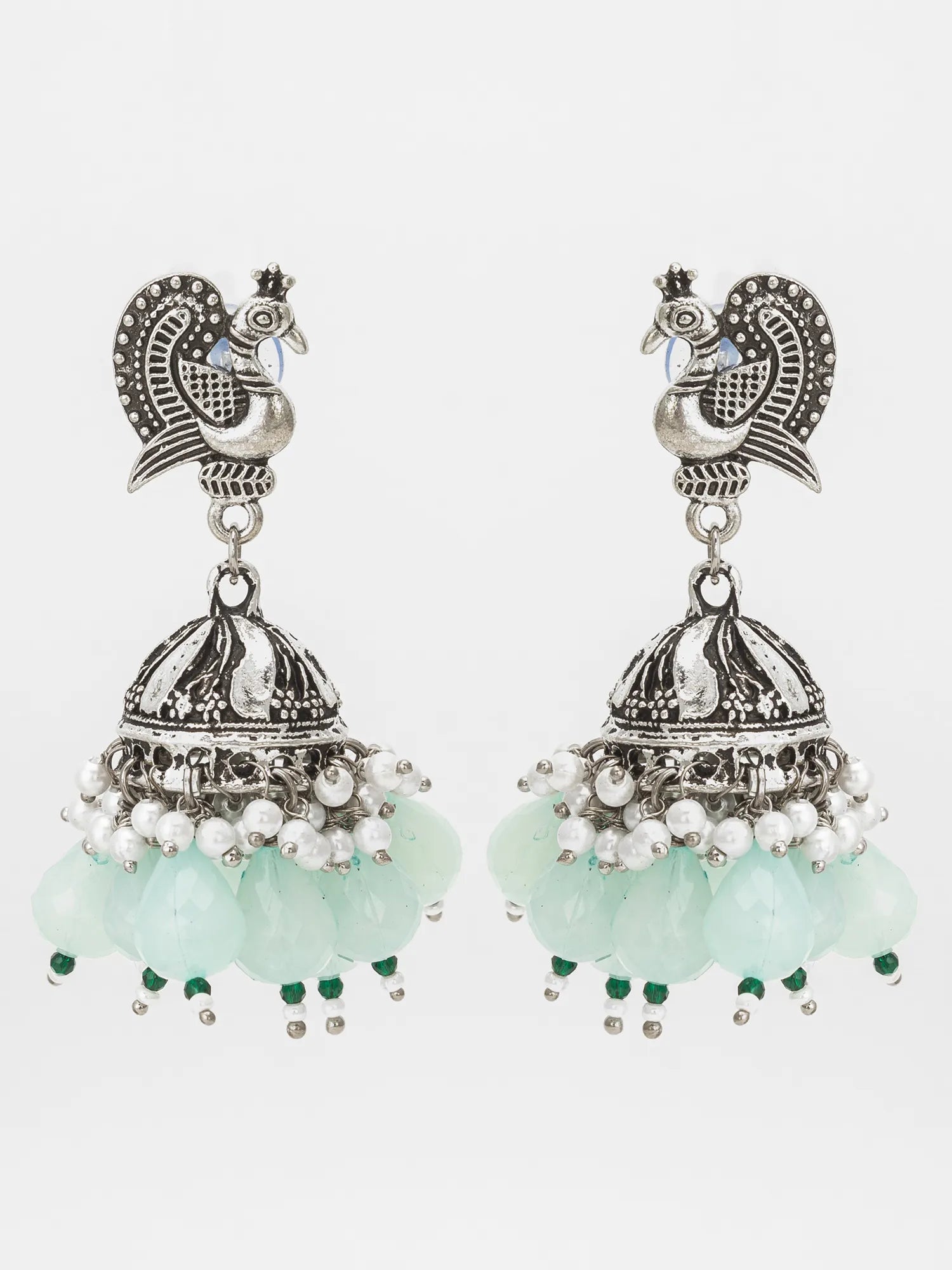 Mint Green Oxidized Jhumka Earrings On A White Background