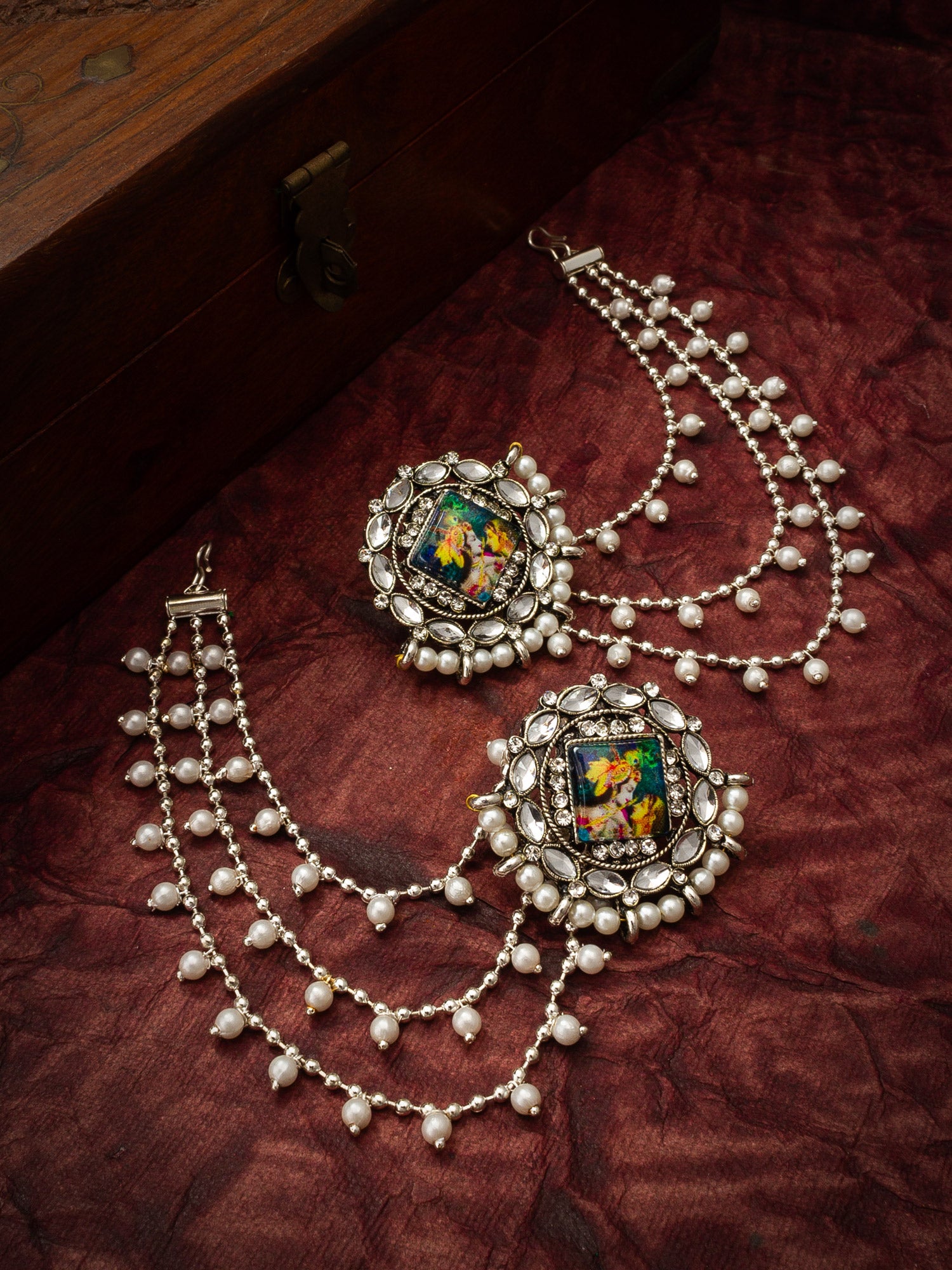 Aadita Silver Oxidized Bahubali Earrings with Divine Motif Centre and Multi-Layer Pearl Chain