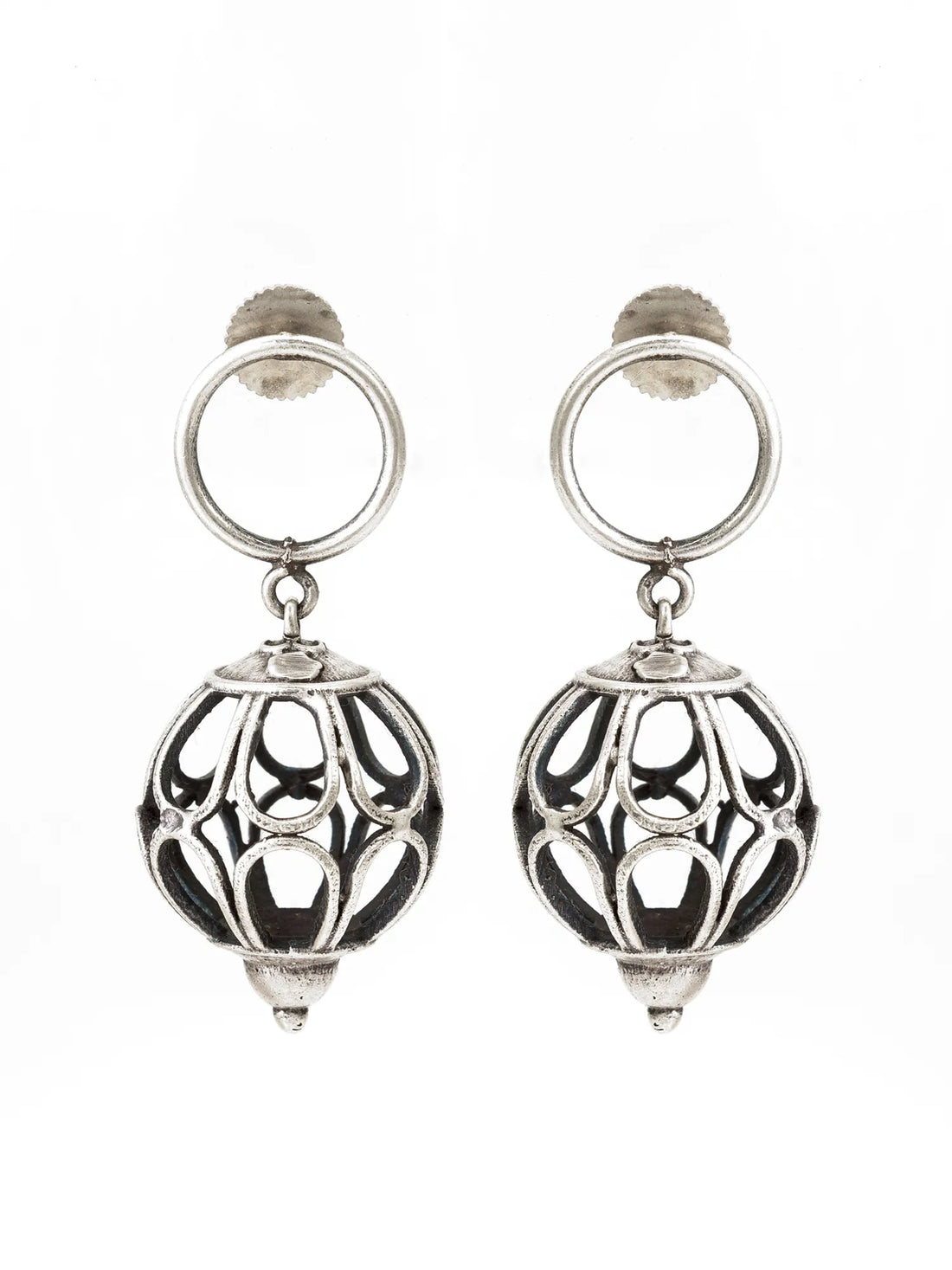 Oxidized Silver Cutwork Ball Drop Earrings On A Red Background