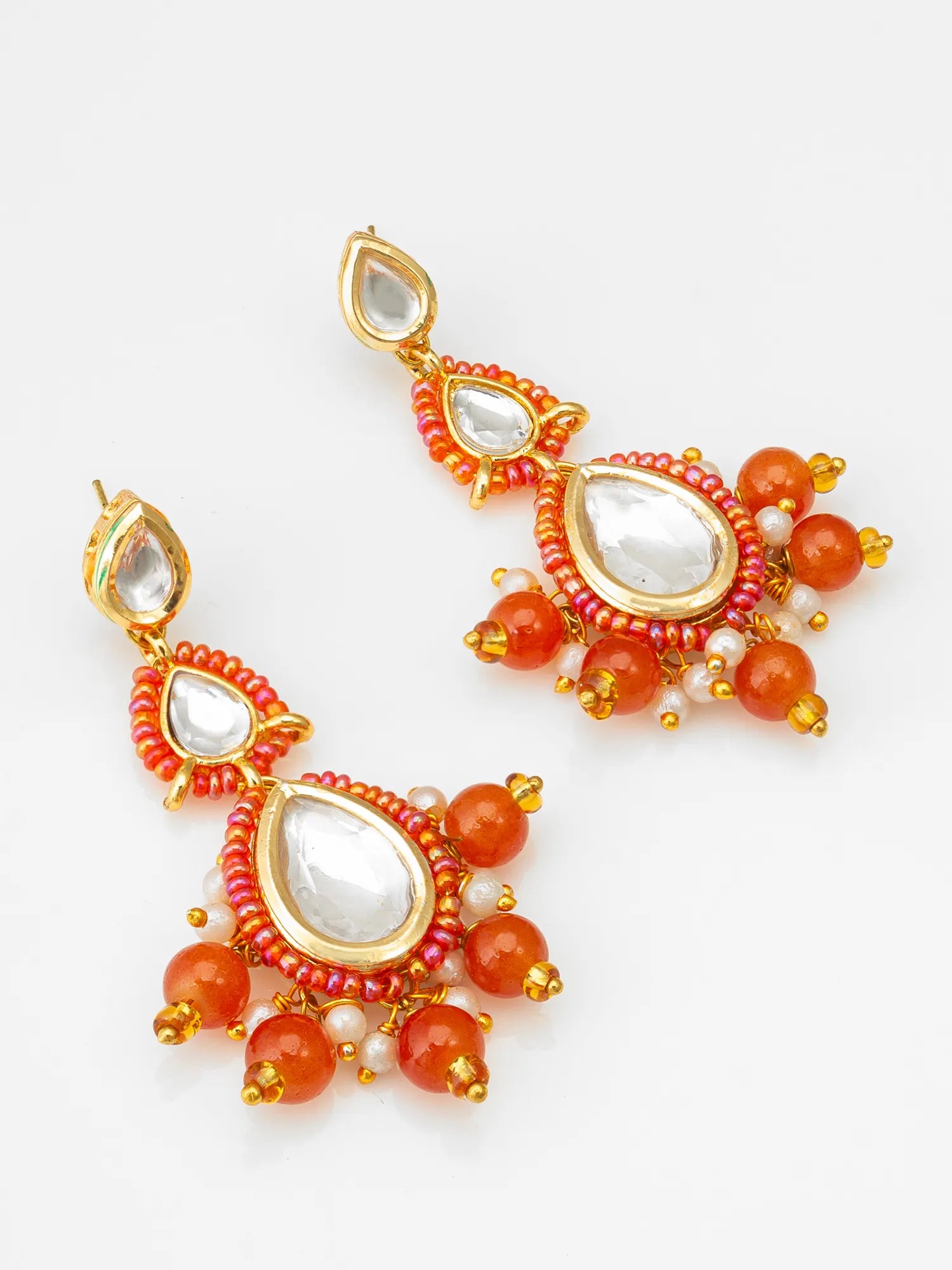 Gold-Toned Kundan Earrings On A White Background
