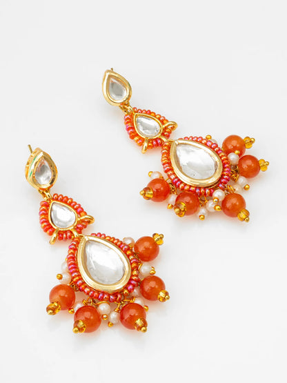 Gold-Toned Kundan Earrings On A White Background
