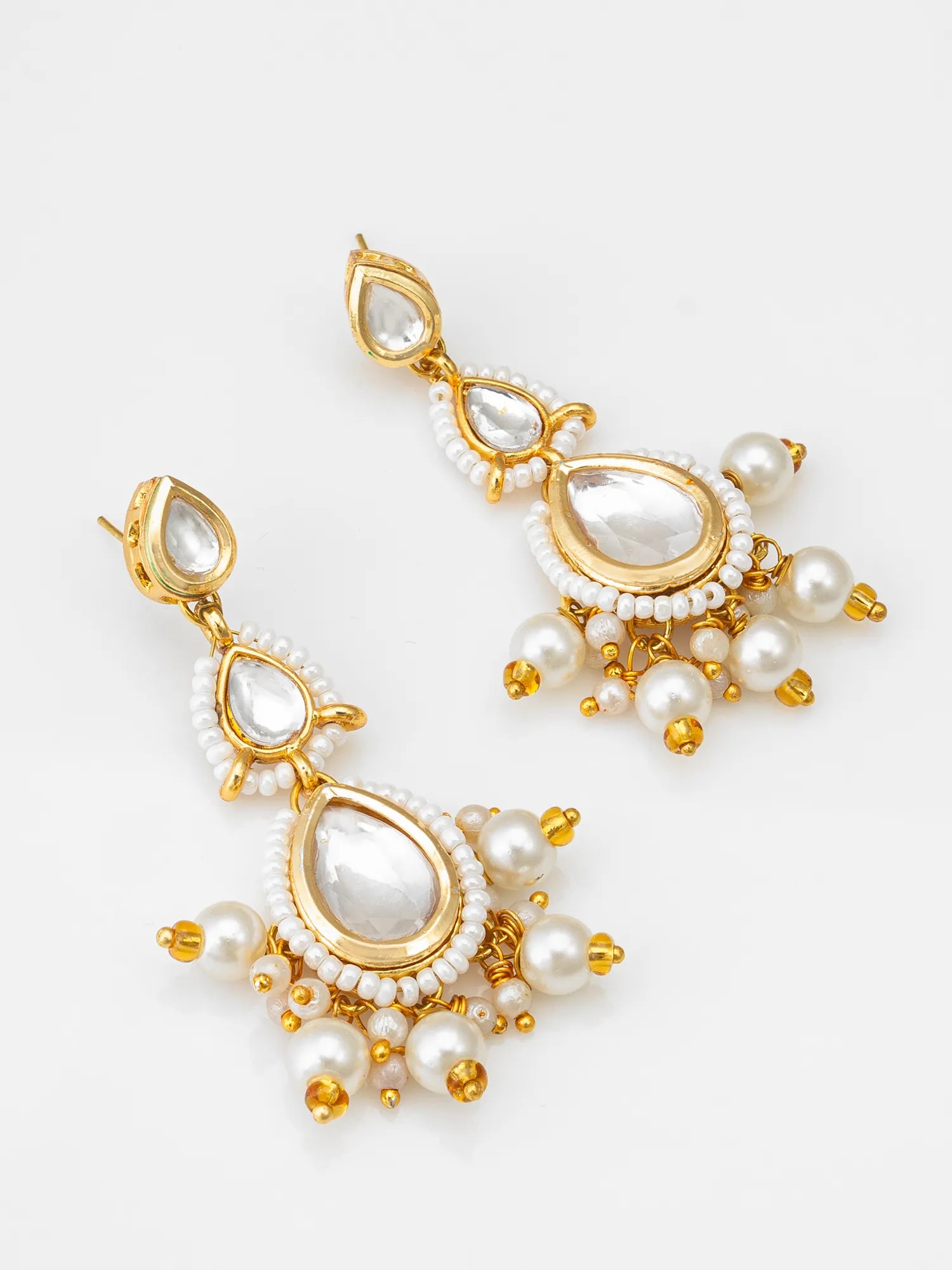 Kundan Pearl Earrings On A White Background