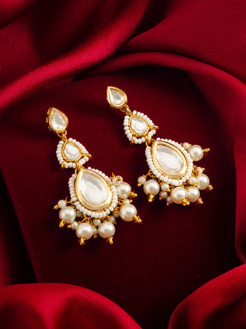 Kundan Pearl Earrings On A Red Background