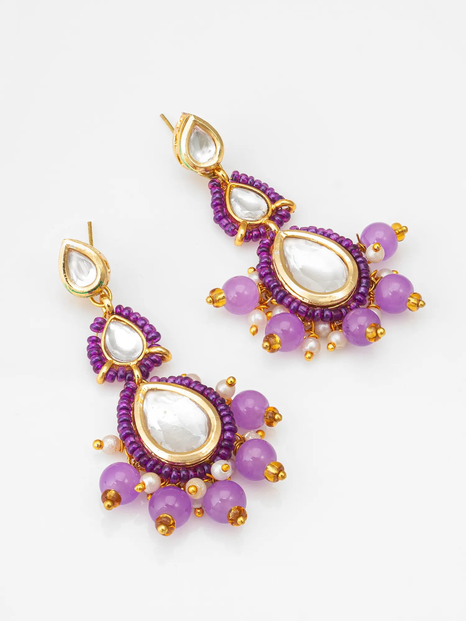 Purple Kundan Beaded Drop Earrings On A White Background