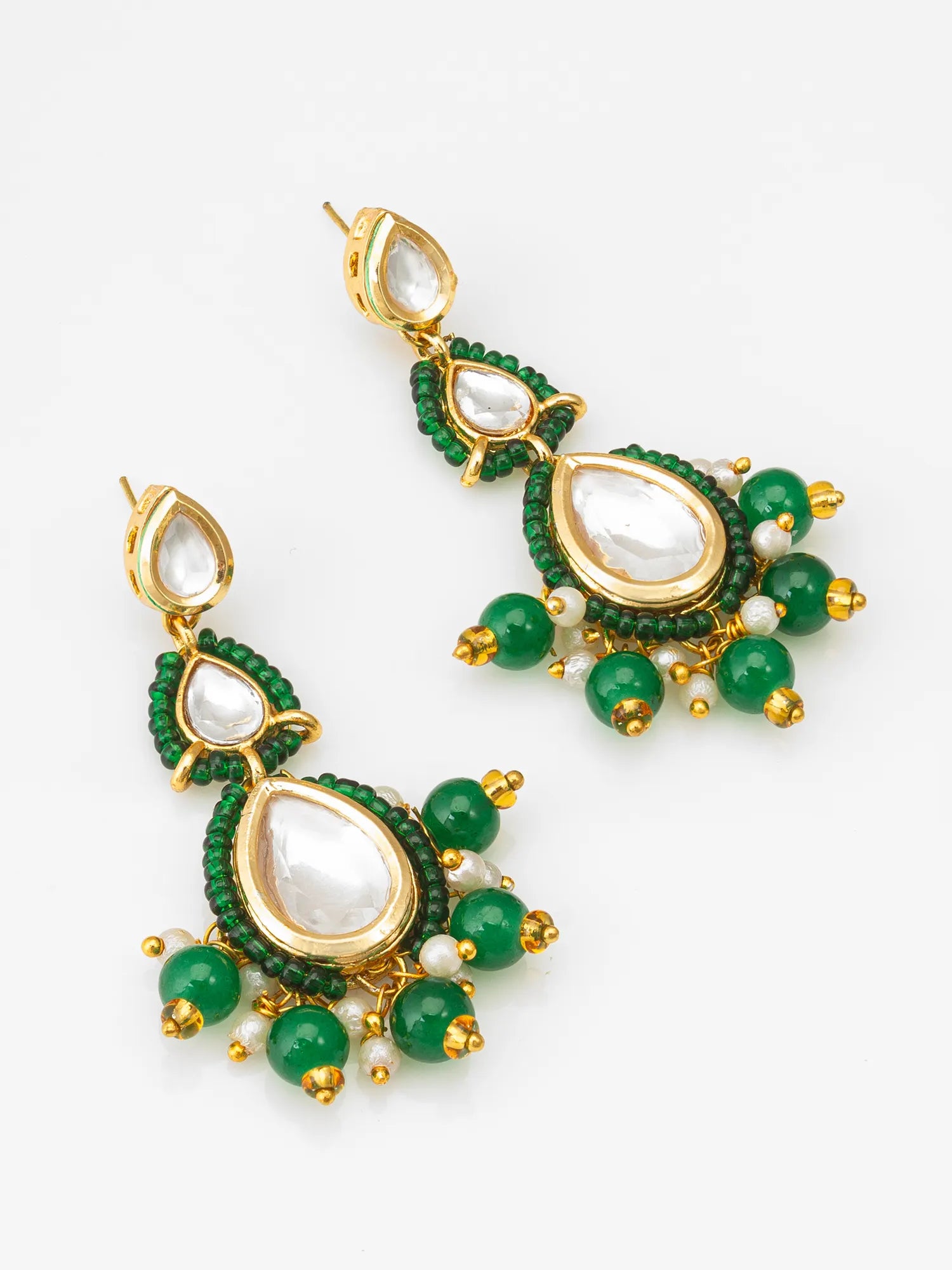 Gold-Toned Kundan Earrings On A White Background