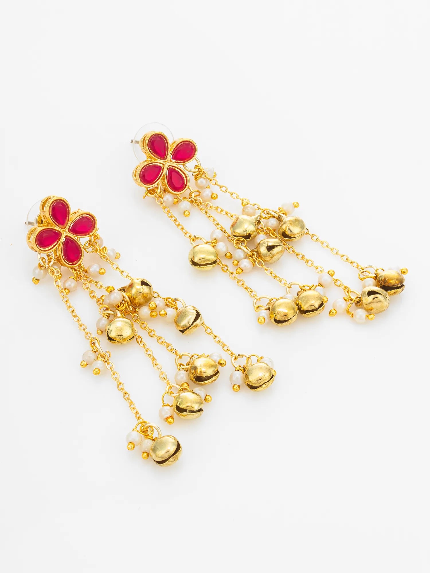 A pair of gold-toned dangle earrings with red enamel flower motifs and small dangling gold bells, shown on a plain white background.