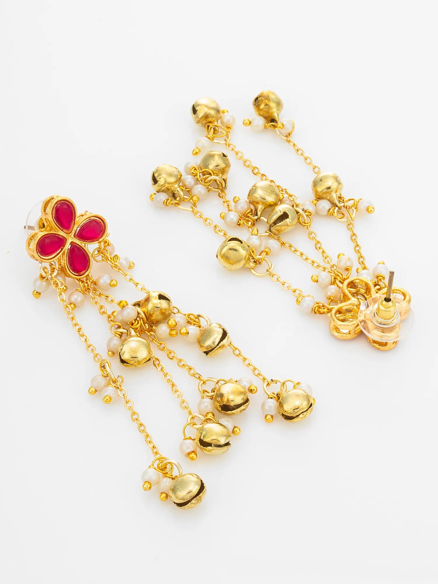 A pair of gold-toned dangle earrings with a red floral motif at the top, small white pearl-like beads, and multiple dangling gold bell charms on a plain white background.