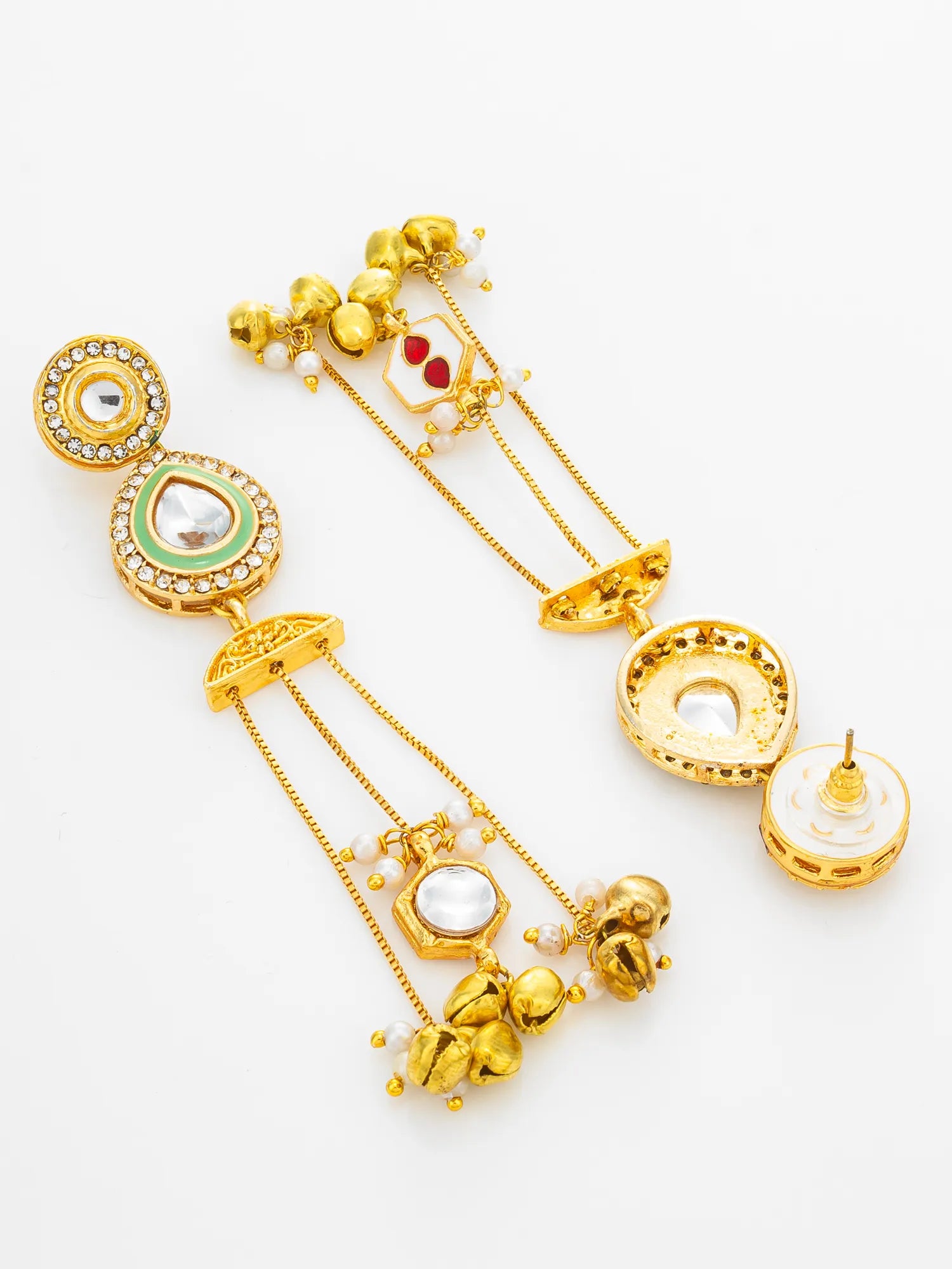 A pair of gold-plated Indian Kundan dangle earrings with green and red enamel details, clear stones, and white pearl-like beads, displayed on a clean white background.