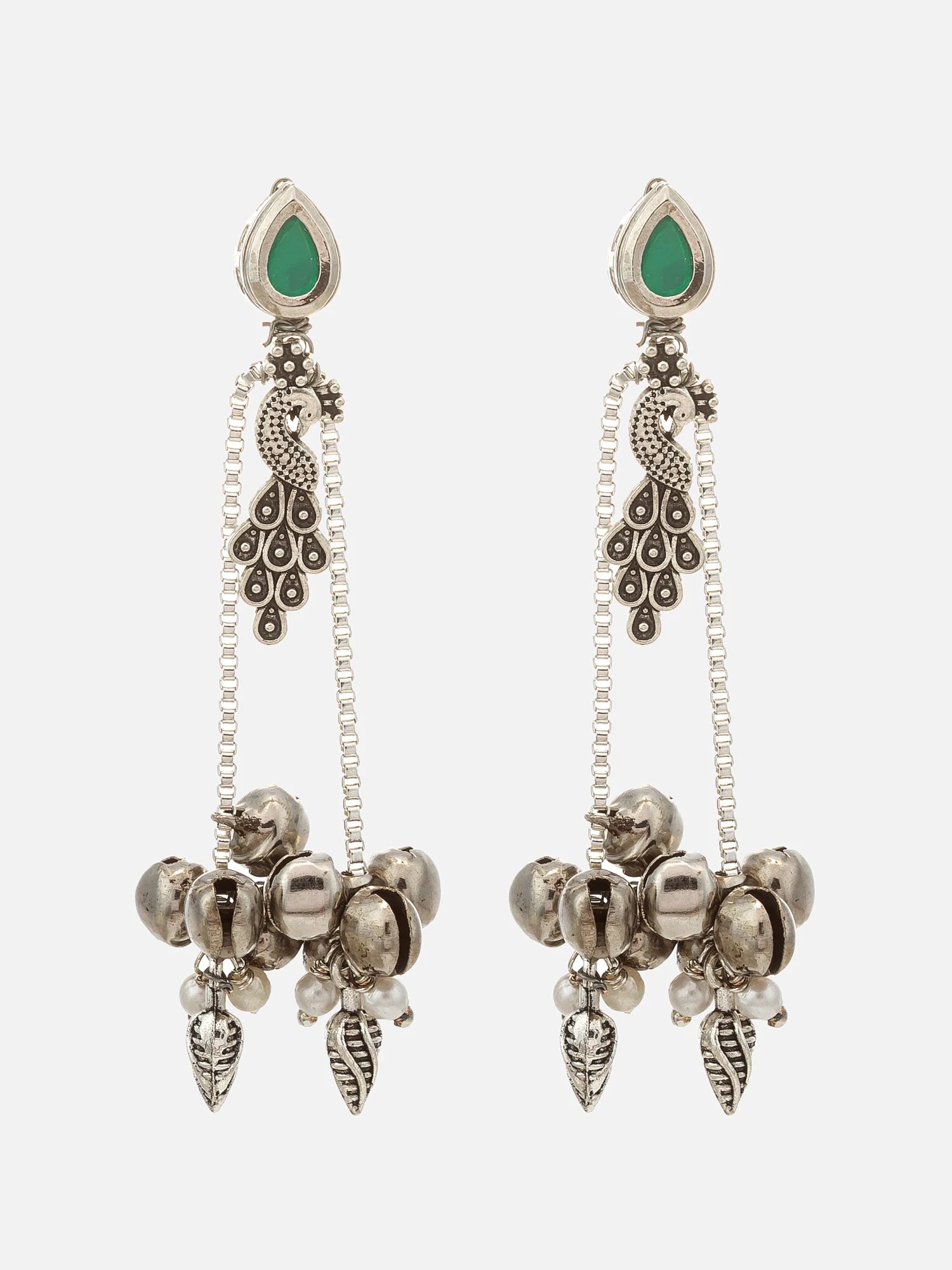 A pair of silver-toned dangle earrings with green teardrop-shaped stones at the top and multiple dangling bell and leaf charms, shown on a light gray background.