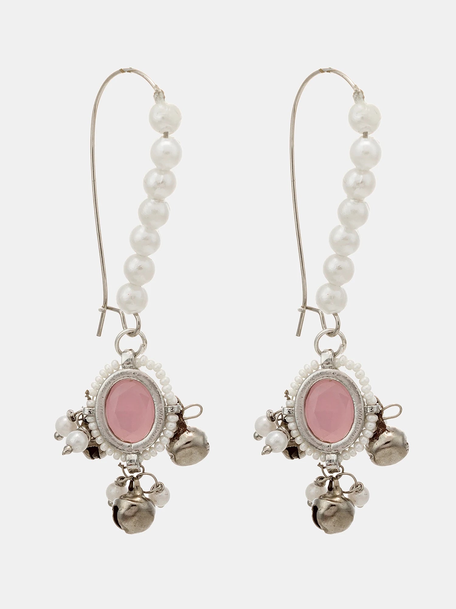 A pair of silver-toned drop earrings featuring a vertical strand of white faux pearls, an oval pink stone centerpiece, and dangling silver bells, set against a light gray background.