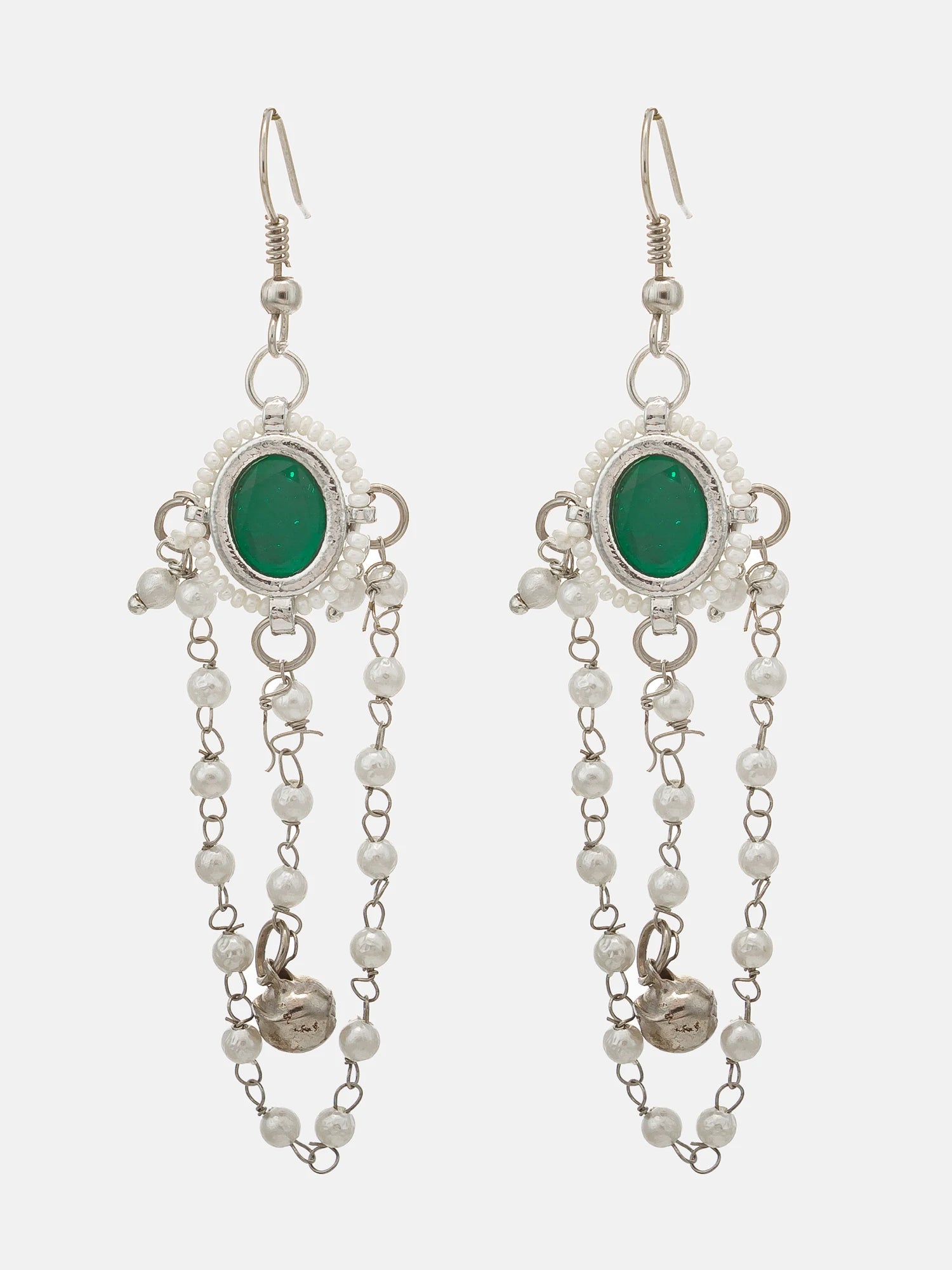 A pair of silver-toned dangle earrings featuring oval green stone centers, surrounded by small white pearl-like beads and hanging chain drops with small silver charms, shown on a light gray background.