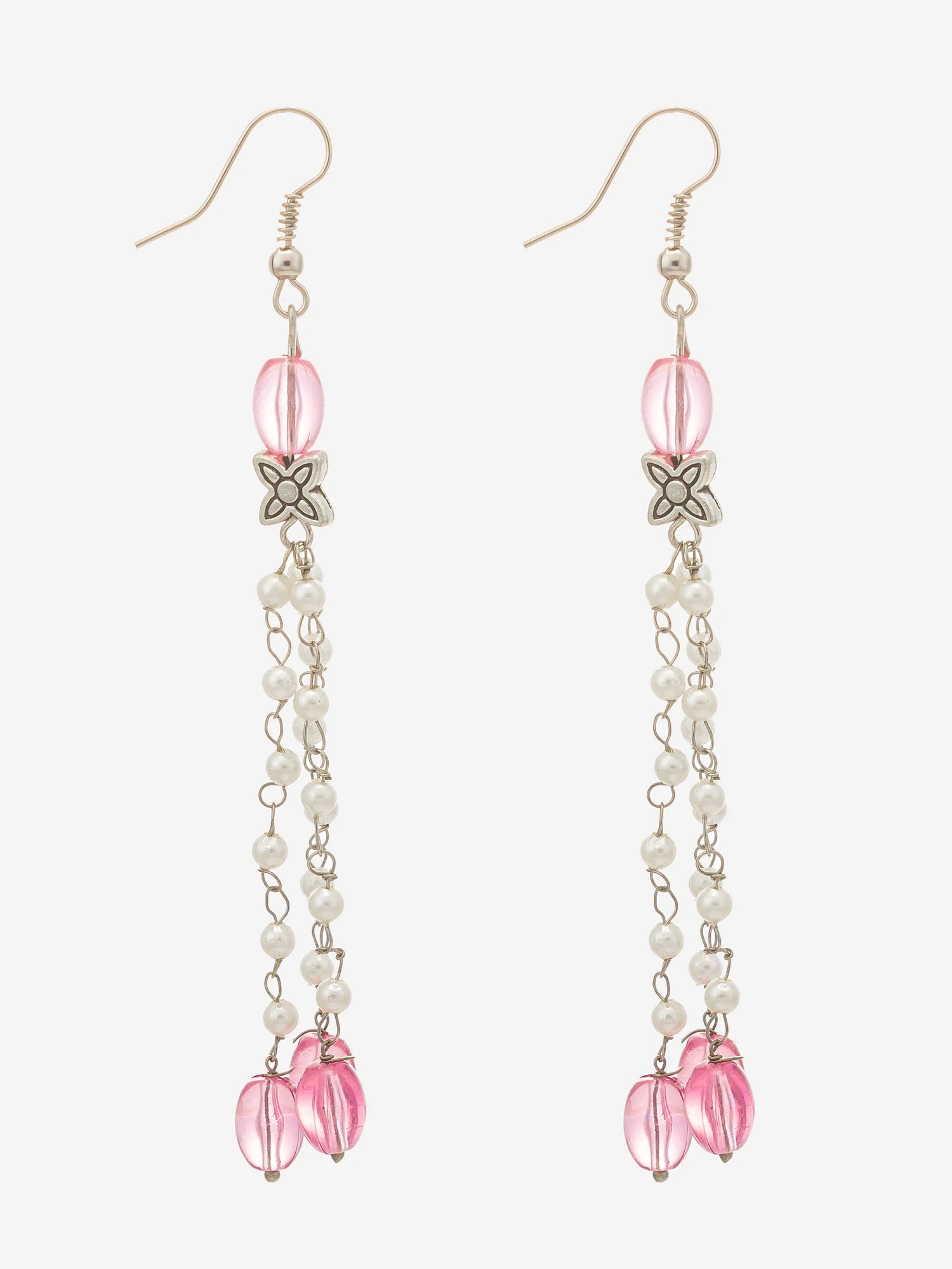A pair of long dangle earrings with silver-tone fishhook wires, pink faceted beads, white pearl-like beads, a small silver flower charm, and two pink teardrop-shaped beads at the bottom, shown on a light gray background.