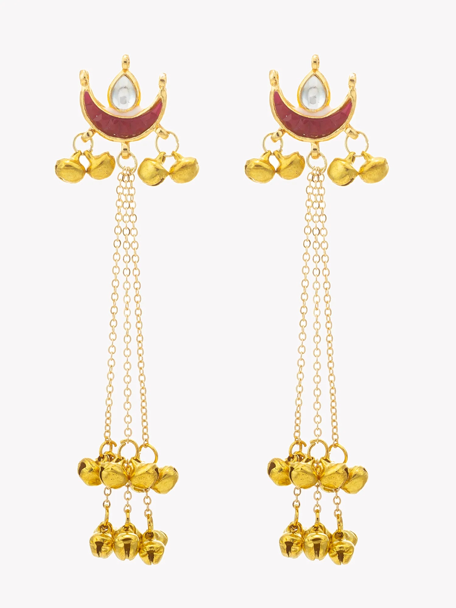 A pair of gold-toned traditional Indian dangle earrings with crescent moon and pearl motifs, red enamel details, and multiple dangling bell charms, shown on a light gray background.