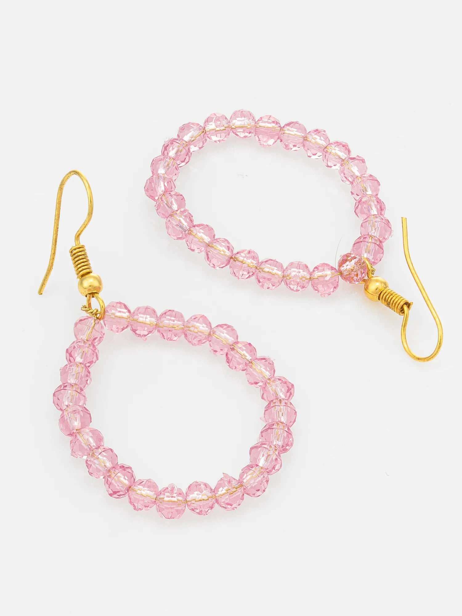 Pink faceted bead hoop earrings with gold-tone fishhook ear wires, displayed on a clean white background.