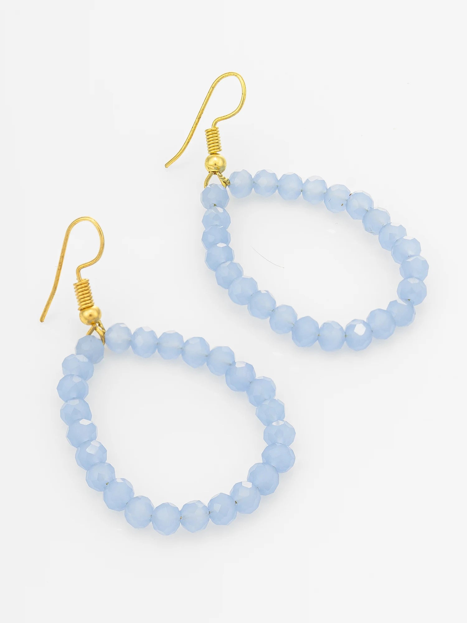 Light blue faceted bead hoop earrings with gold fishhook ear wires, shown on a clean white background.