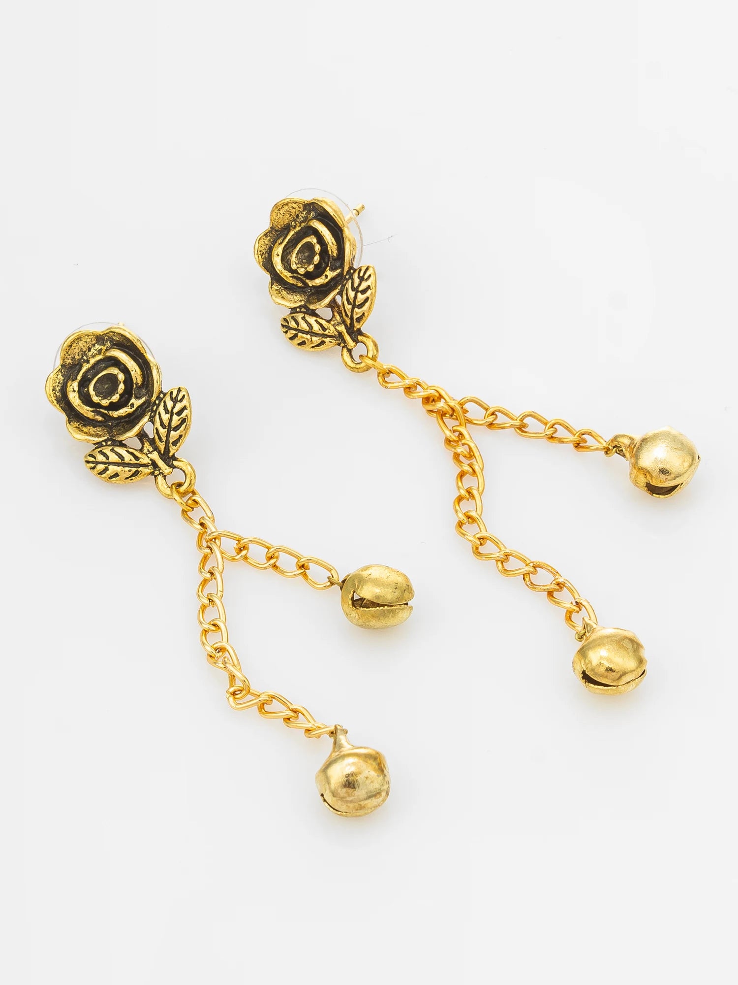 A pair of gold-tone rose dangle earrings with small chain links and bead-like drops, photographed on a plain white background.