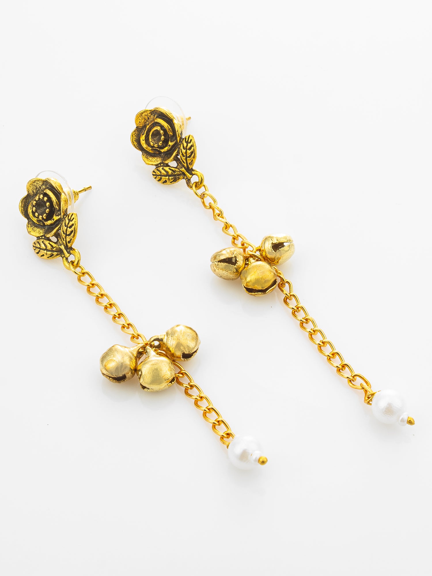 A pair of gold-toned dangle earrings featuring rose motifs, small bell charms, chain links, and white pearl beads at the ends, displayed on a clean white background.