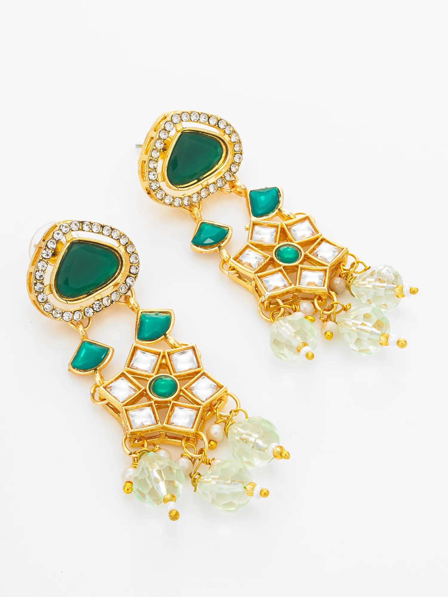 A pair of gold-plated dangle earrings featuring green enamel inlays, clear rhinestones, and hanging clear faceted beads, displayed on a clean white background.