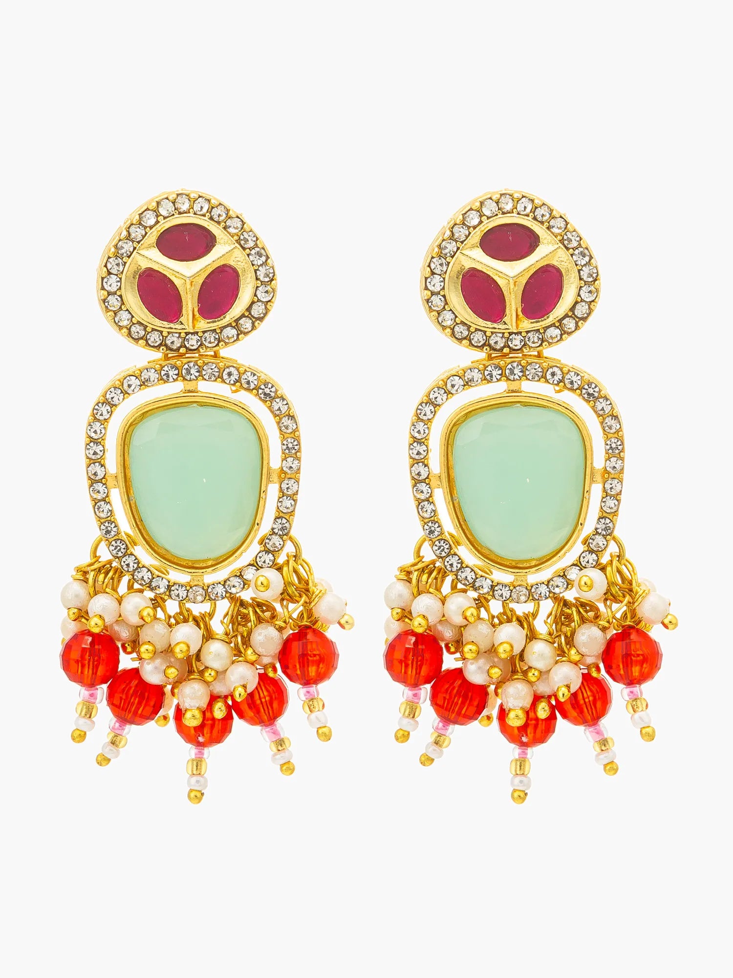 A pair of gold-plated statement earrings featuring a large oval mint green stone, a smaller circular magenta stone above it, and dangling red beads and white pearl-like accents, set against a plain white background.