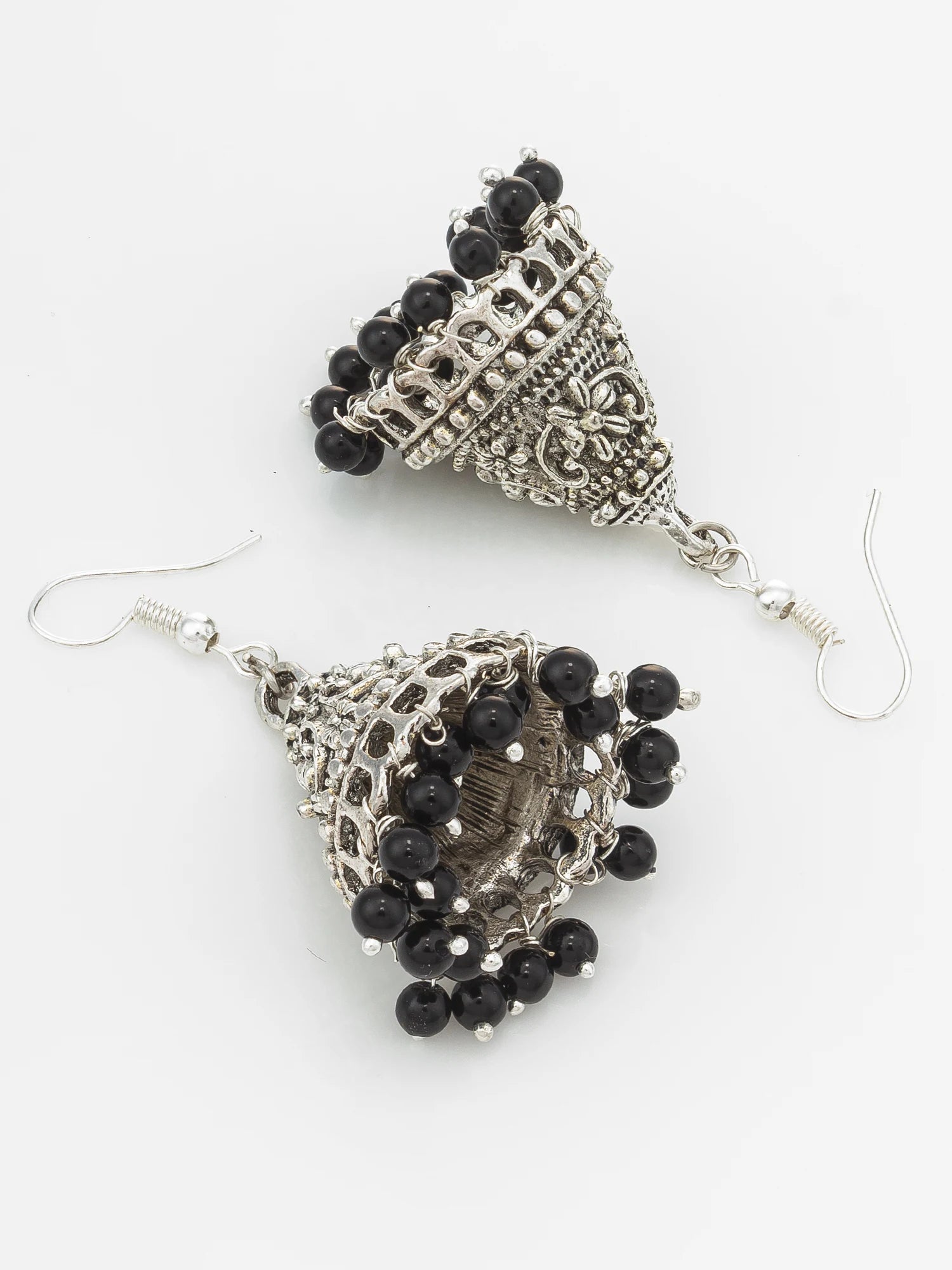 A pair of silver-toned filigree dangle earrings with black bead fringe, displayed on a clean white background.