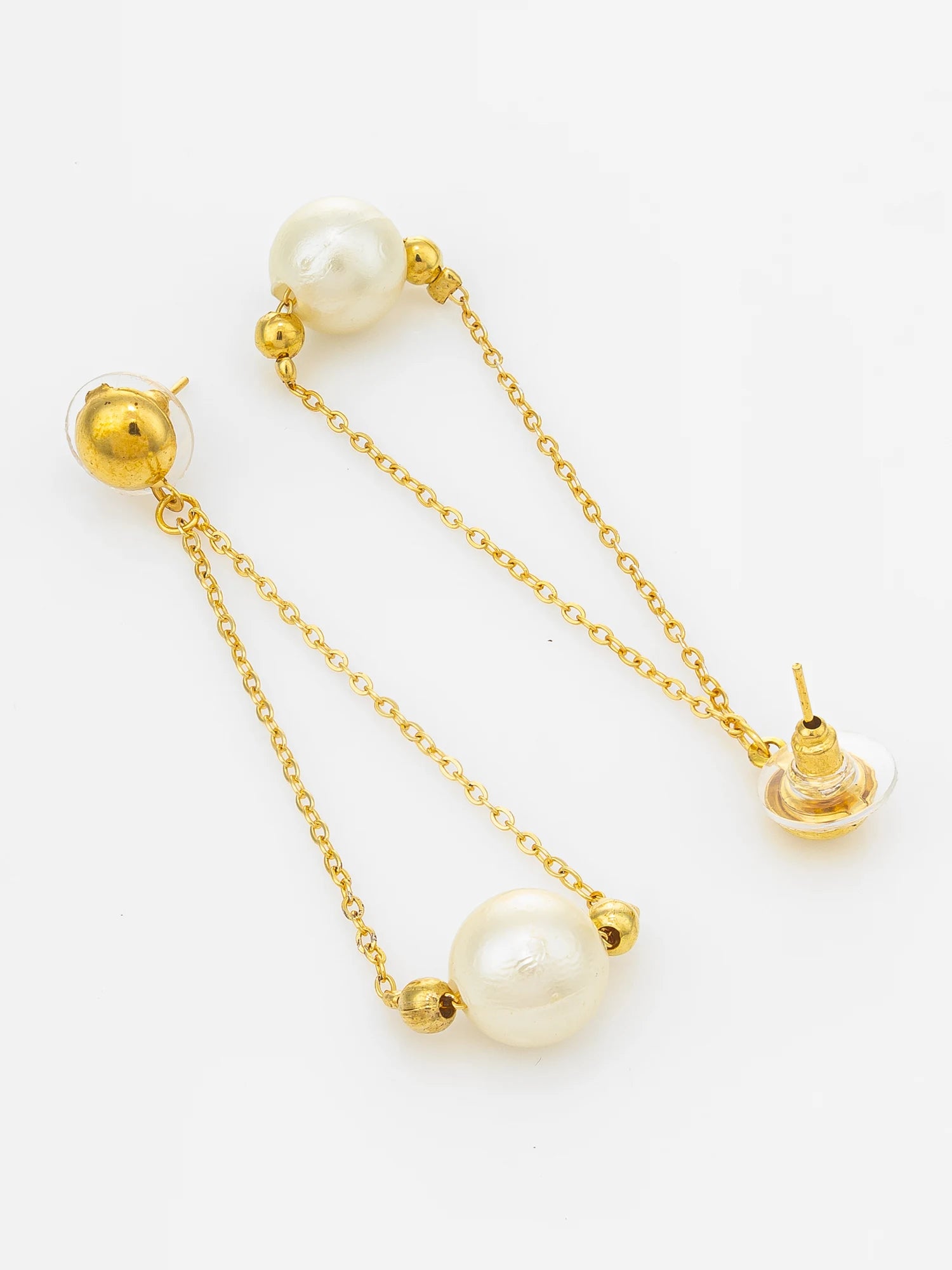 A pair of gold dangle earrings with large white freshwater pearls, shown on a clean white background.