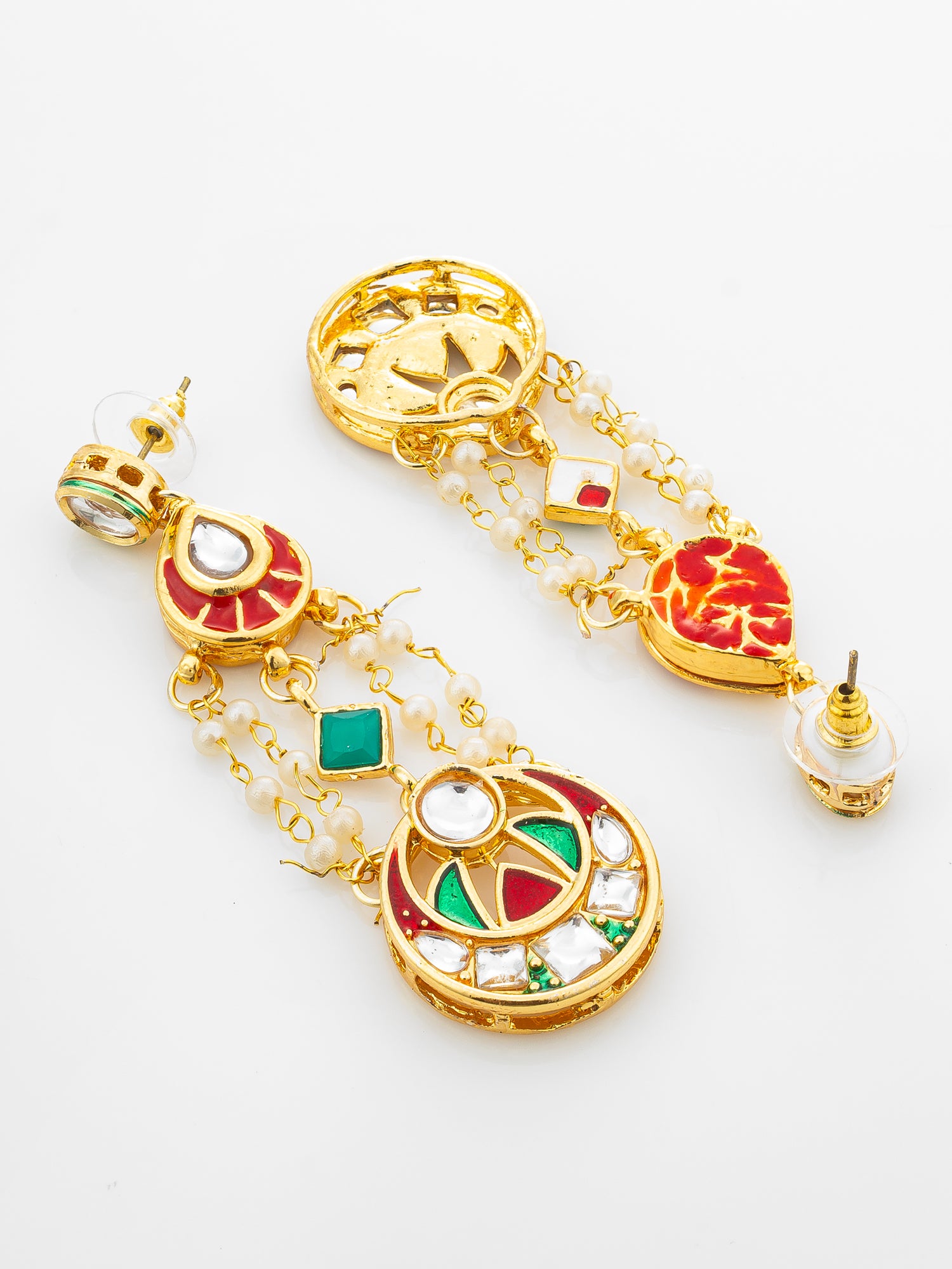 A pair of ornate gold-toned dangle earrings with red and green enamel details, white bead chains, and clear rhinestone accents, displayed on a clean white background.