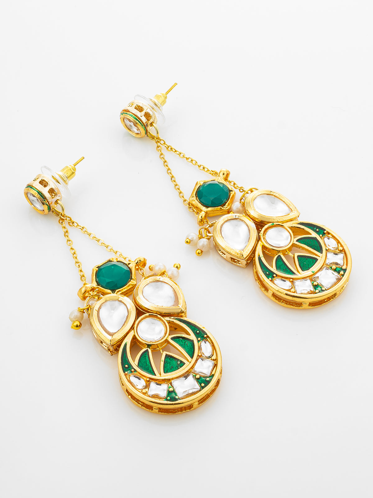 A pair of gold-plated Indian Kundan dangle earrings with green enamel, white stones, and small pearl accents, displayed on a clean white background.