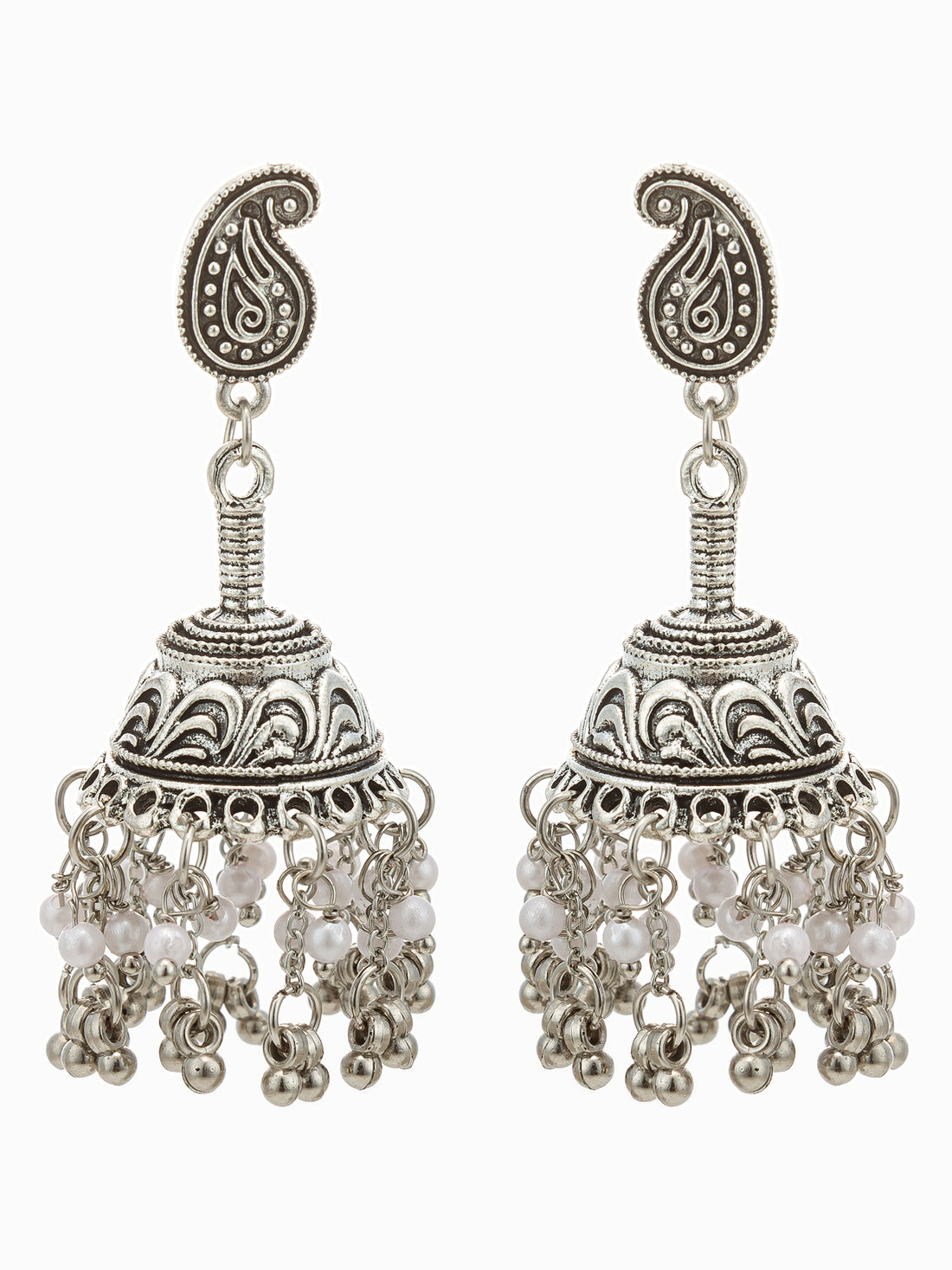 A pair of ornate silver-toned jhumka earrings with paisley-shaped studs, intricate filigree detailing, and dangling pearl-like beads, displayed against a dark background.