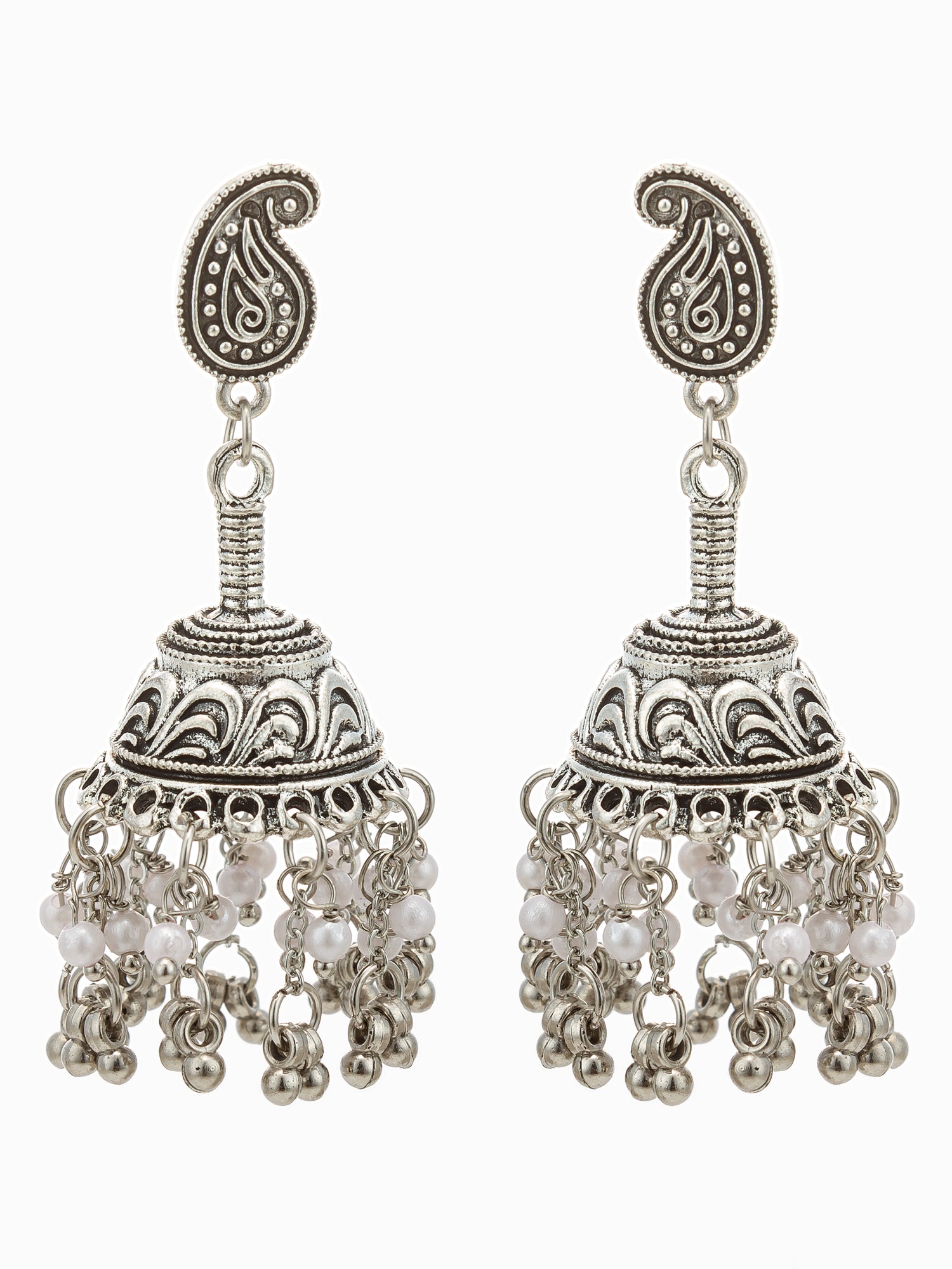 A pair of silver-toned jhumka earrings with intricate paisley and floral engravings, featuring dangling pearl-like beads and small bell charms, shown against a plain white background.