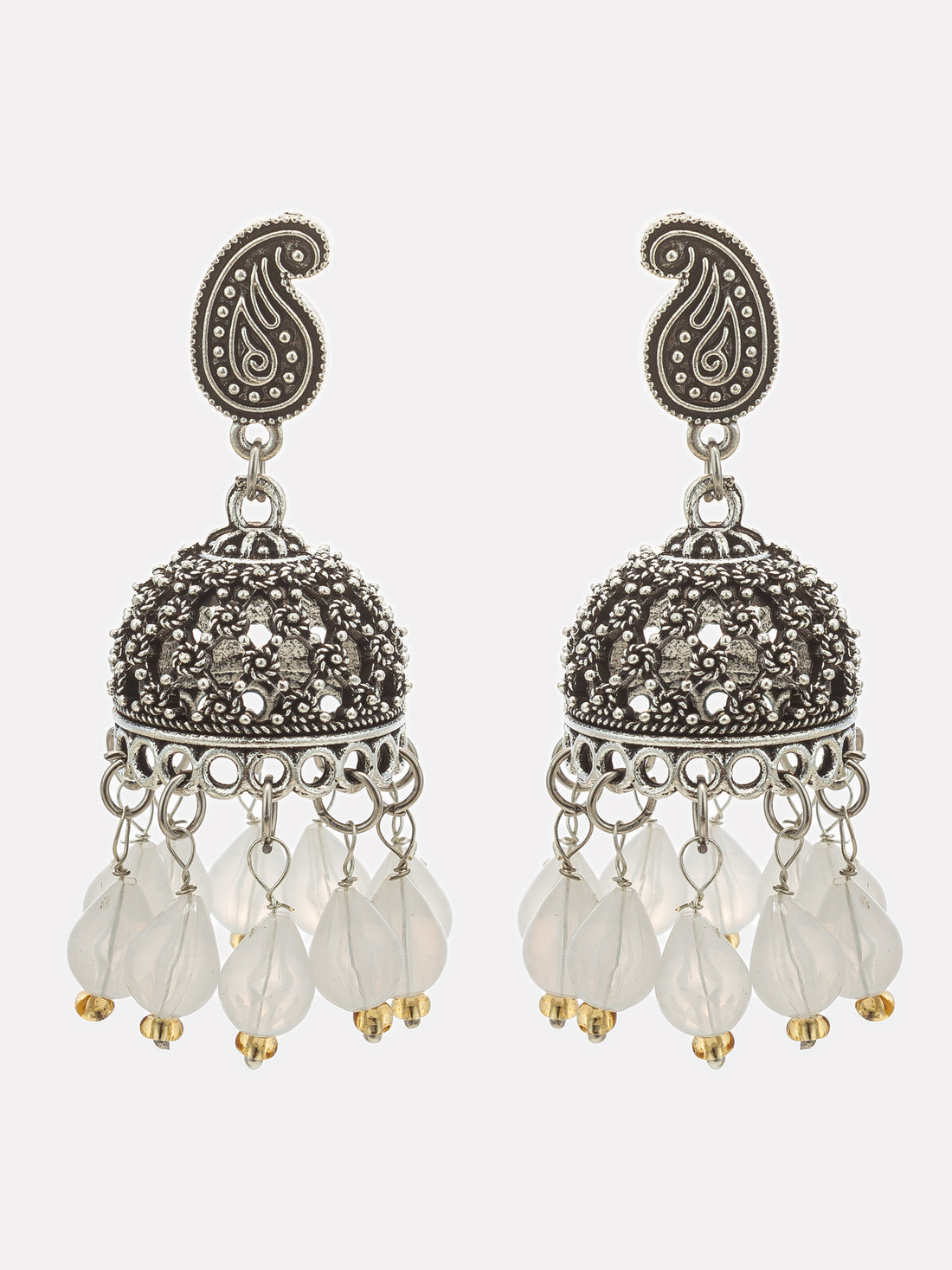 A pair of ornate silver-toned jhumka earrings with intricate paisley and filigree details, featuring dangling translucent white beads, displayed against a dark background.