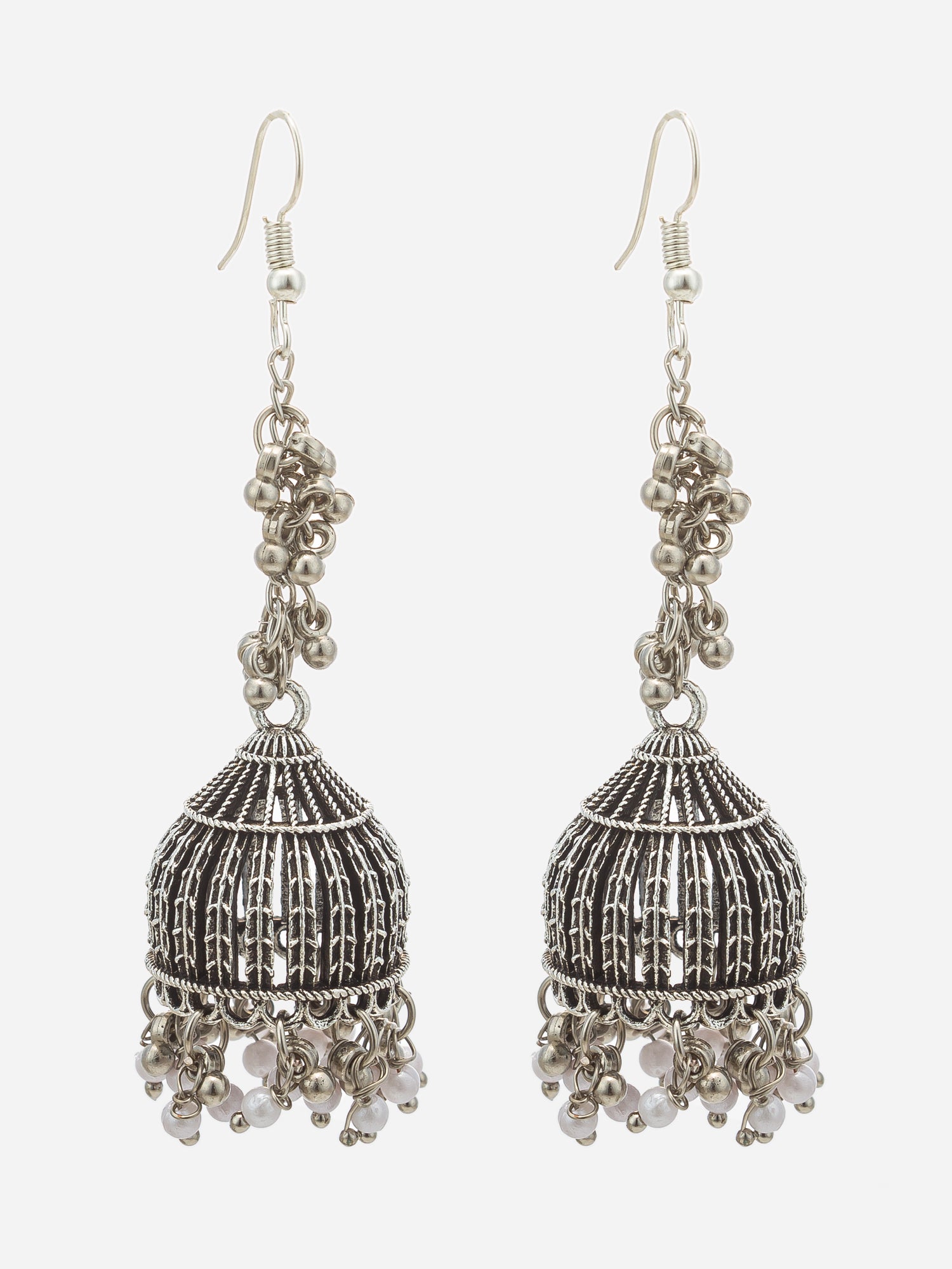A pair of silver-toned jhumka earrings with intricate filigree detailing, bead chains, and dangling pearl-like beads, shown against a plain light gray background.