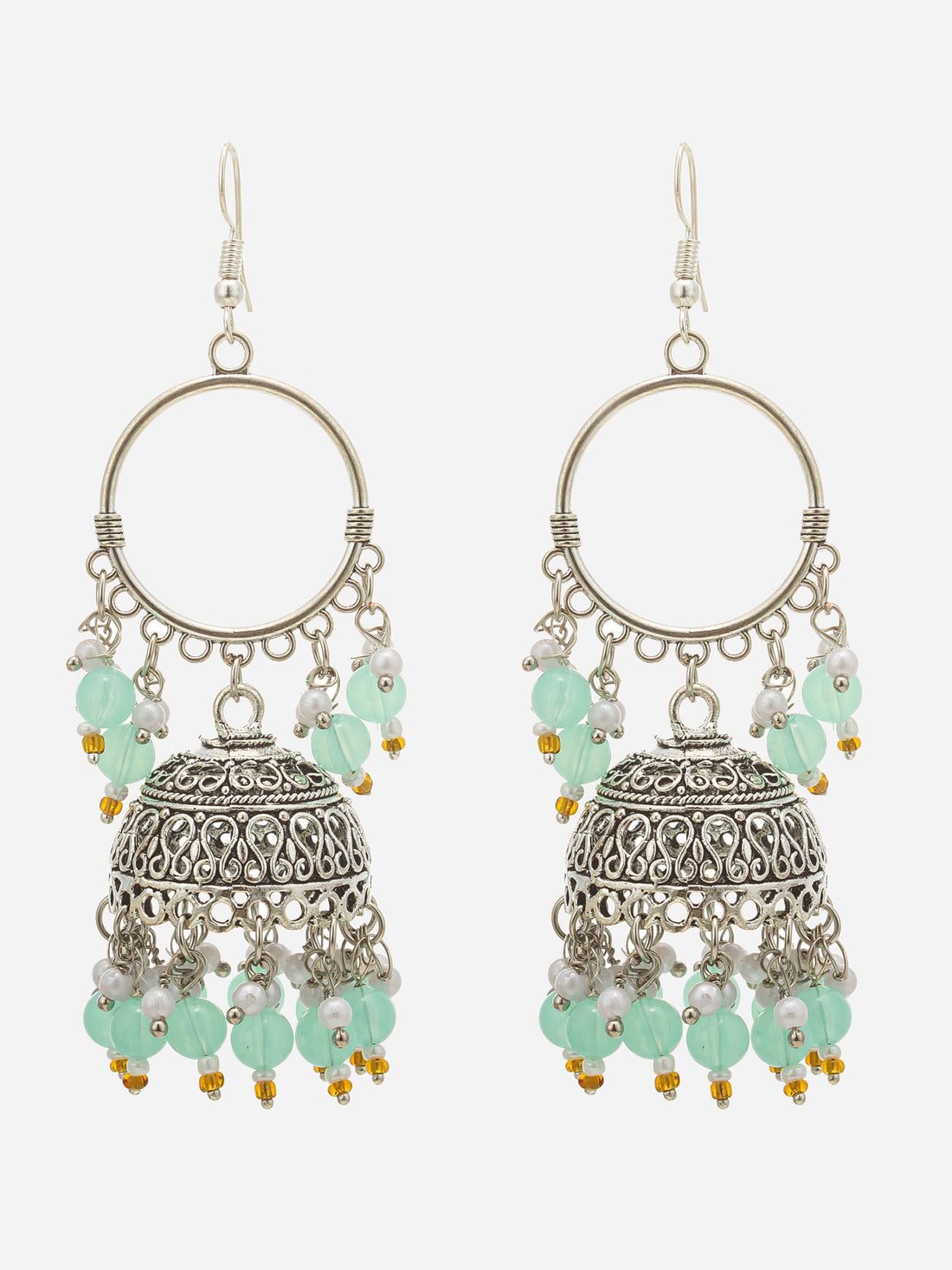 A pair of silver-toned jhumka earrings with intricate filigree detailing, decorated with light blue-green beads and small white pearl-like accents, displayed against a dark background.