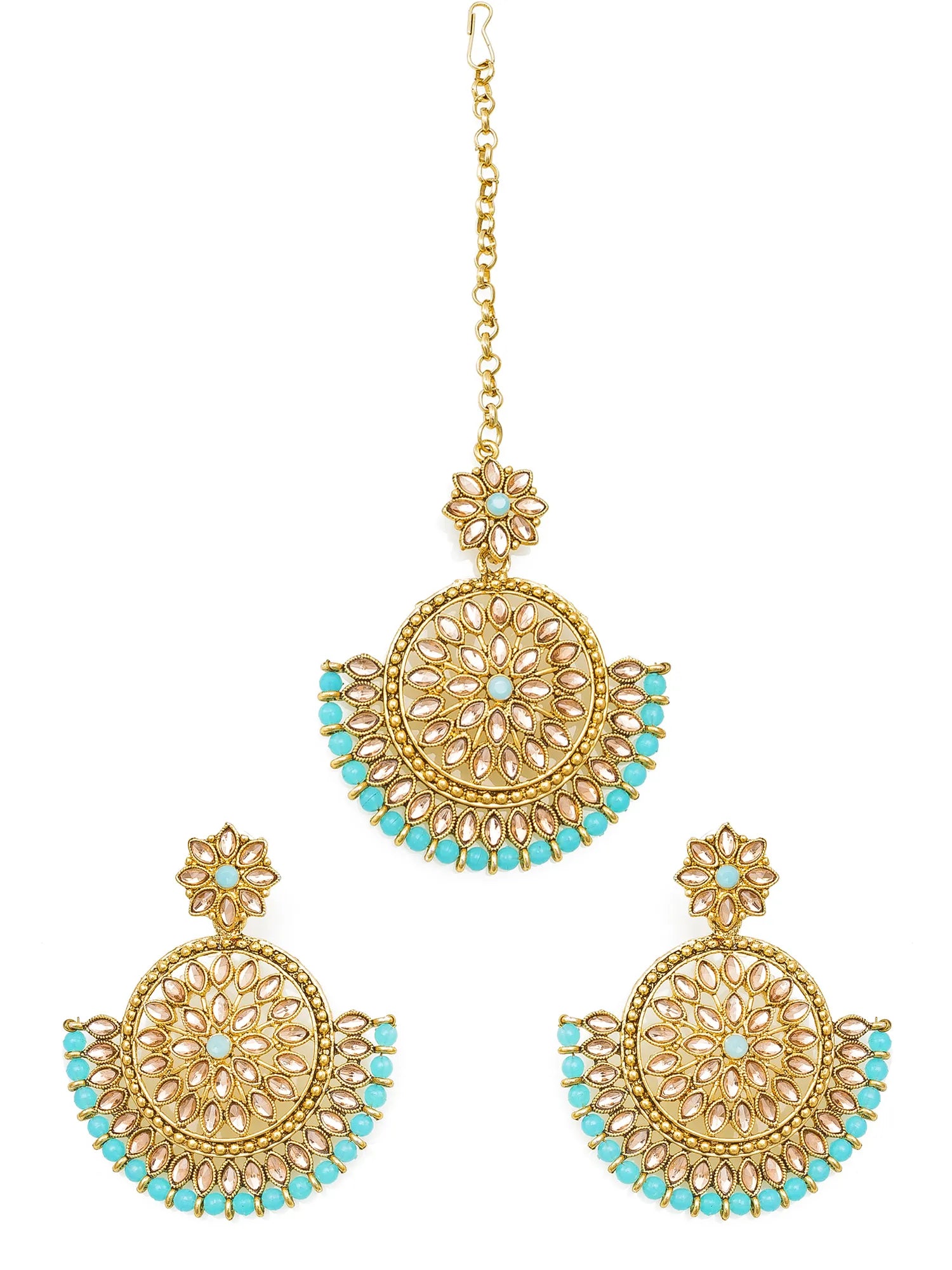 Gold and turquoise earrings on a white background