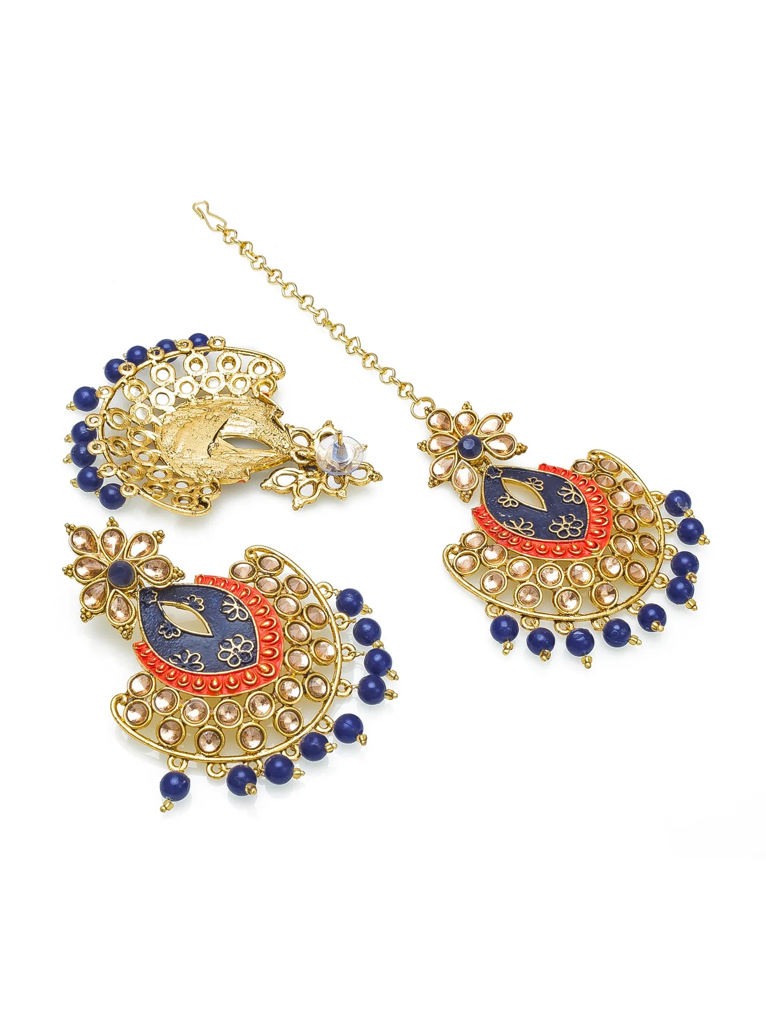 Ornate gold earrings with blue and red accents on a white background