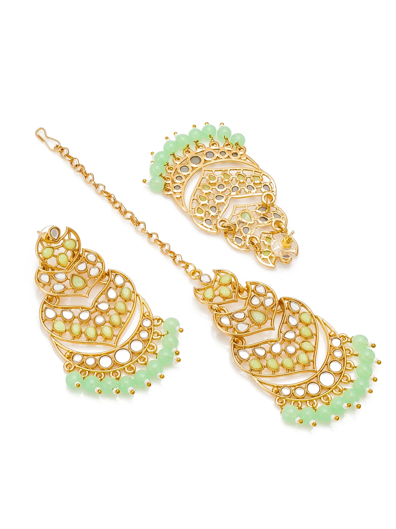 Gold-plated traditional Indian jhumka earrings with light green stone accents and white stone detailing, displayed on a clean white background.