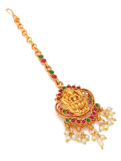 Gold necklace with green and red stones and pearl tassels on a white background