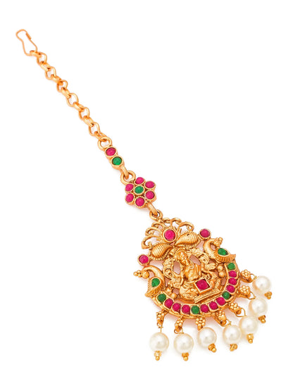 Gold necklace with green and red stones and pearl drops on a white background