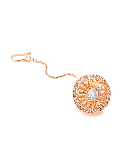 Rose gold earring with a central gemstone on a white background