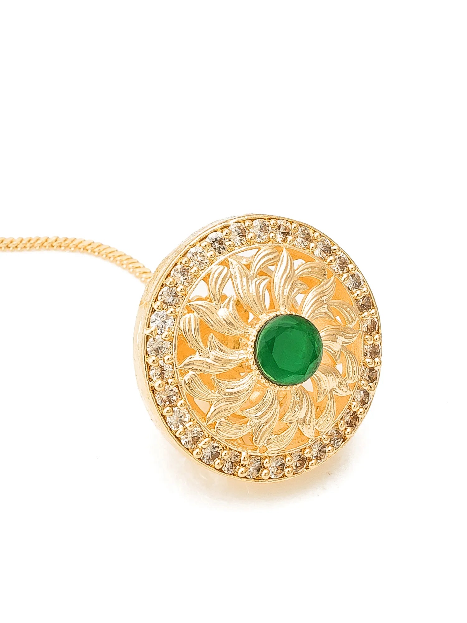 Gold pendant with green gemstone on a white background
