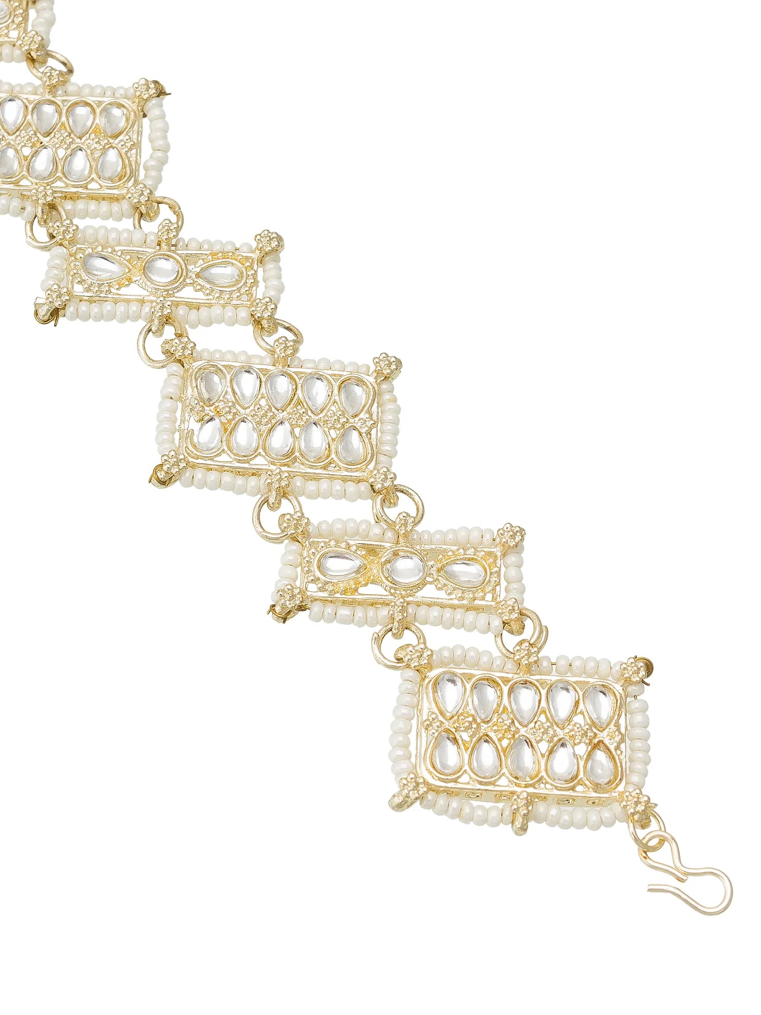 Gold and pearl bracelet on a white background