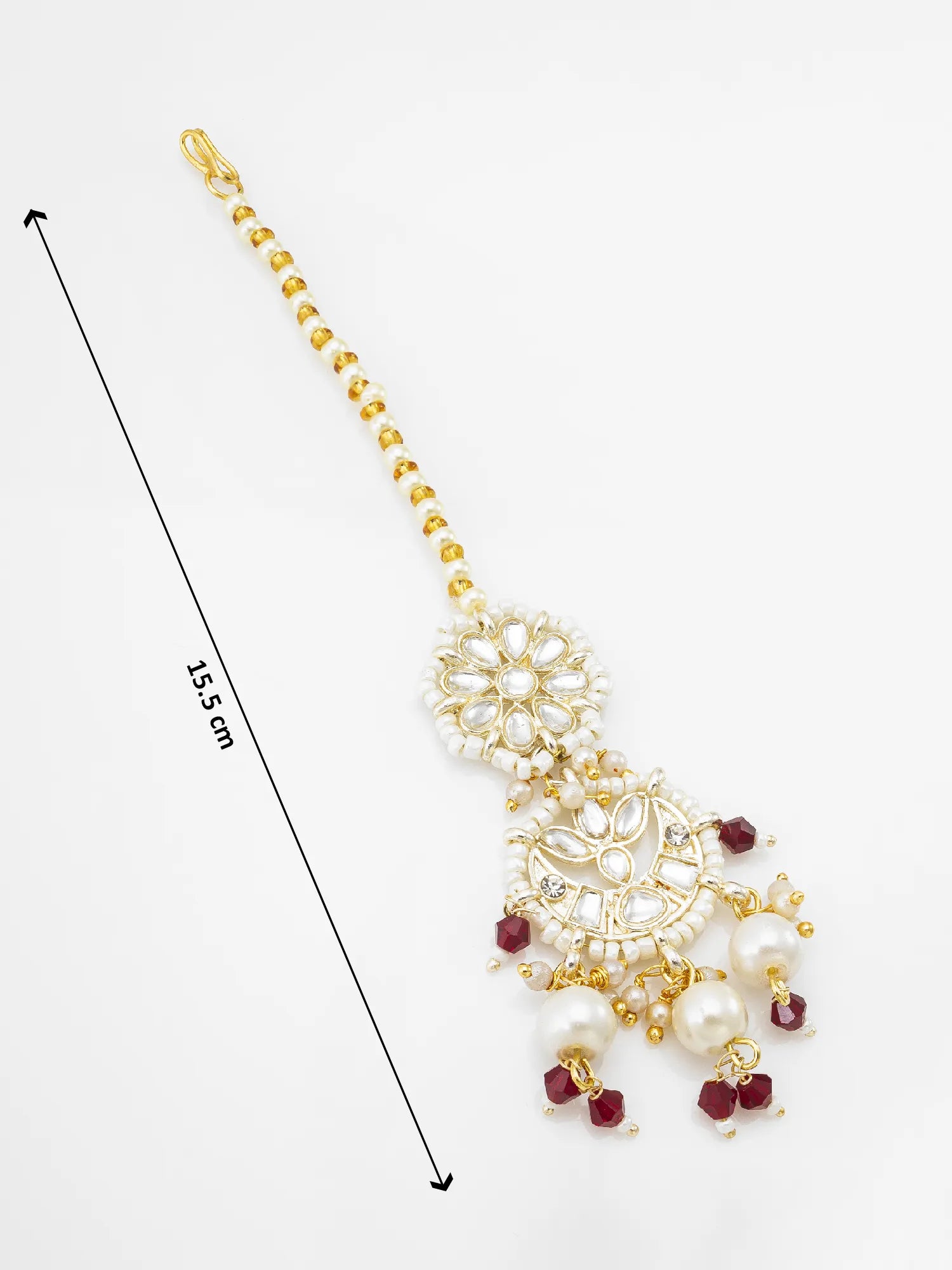 Gold and white pearl maang tikka with maroon bead accents, shown on a white background with a 15.5 cm length indicator.
