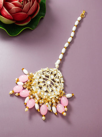 Decorative necklace with pink and white beads on a purple background
