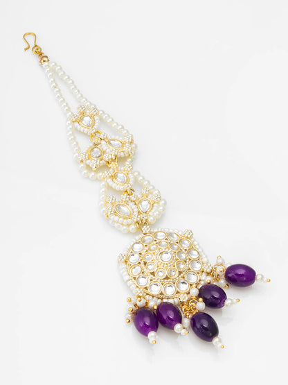Necklace with gold, white, and purple beads on a white background