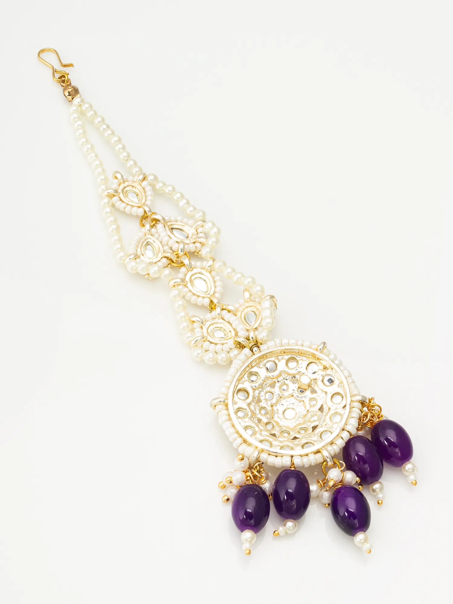 Decorative necklace with purple beads and gold accents on a white background
