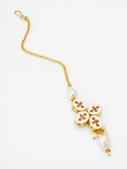Decorative bracelet with floral designs and pearls on a white background