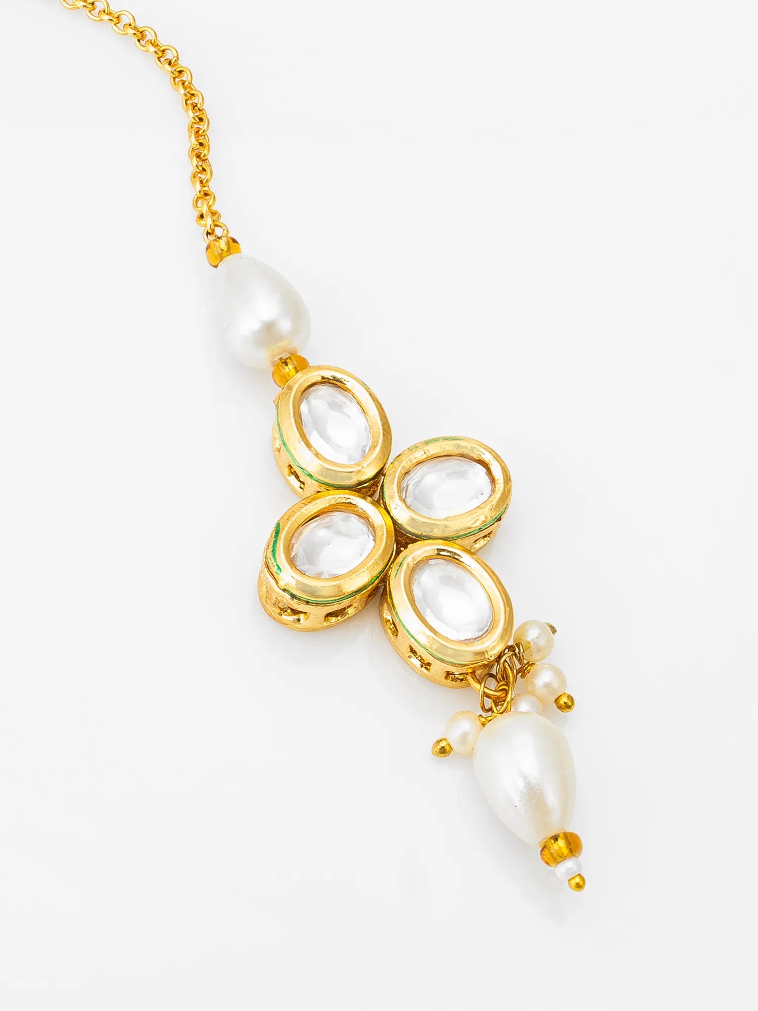 Gold necklace with pearl pendants on a white background