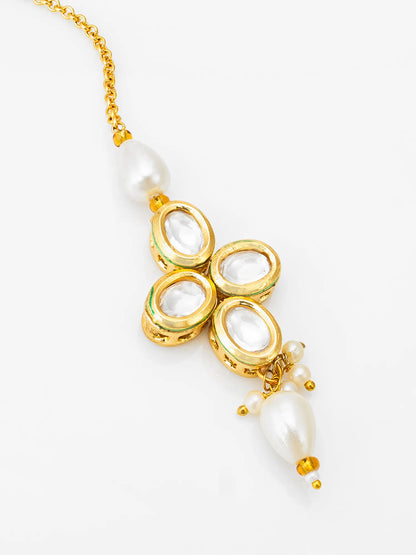 Gold necklace with pearl pendants on a white background